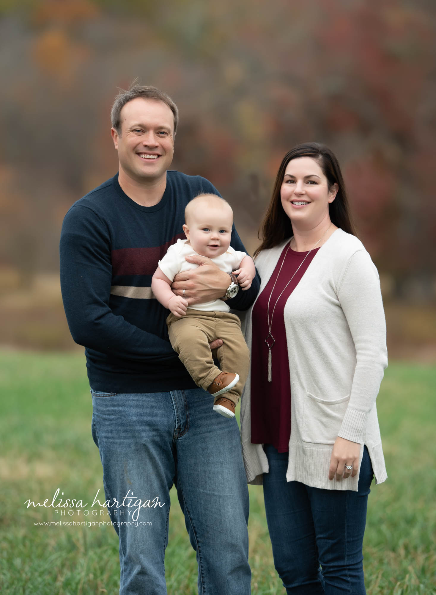 mom dad and baby son family pose tolland county CT family photography