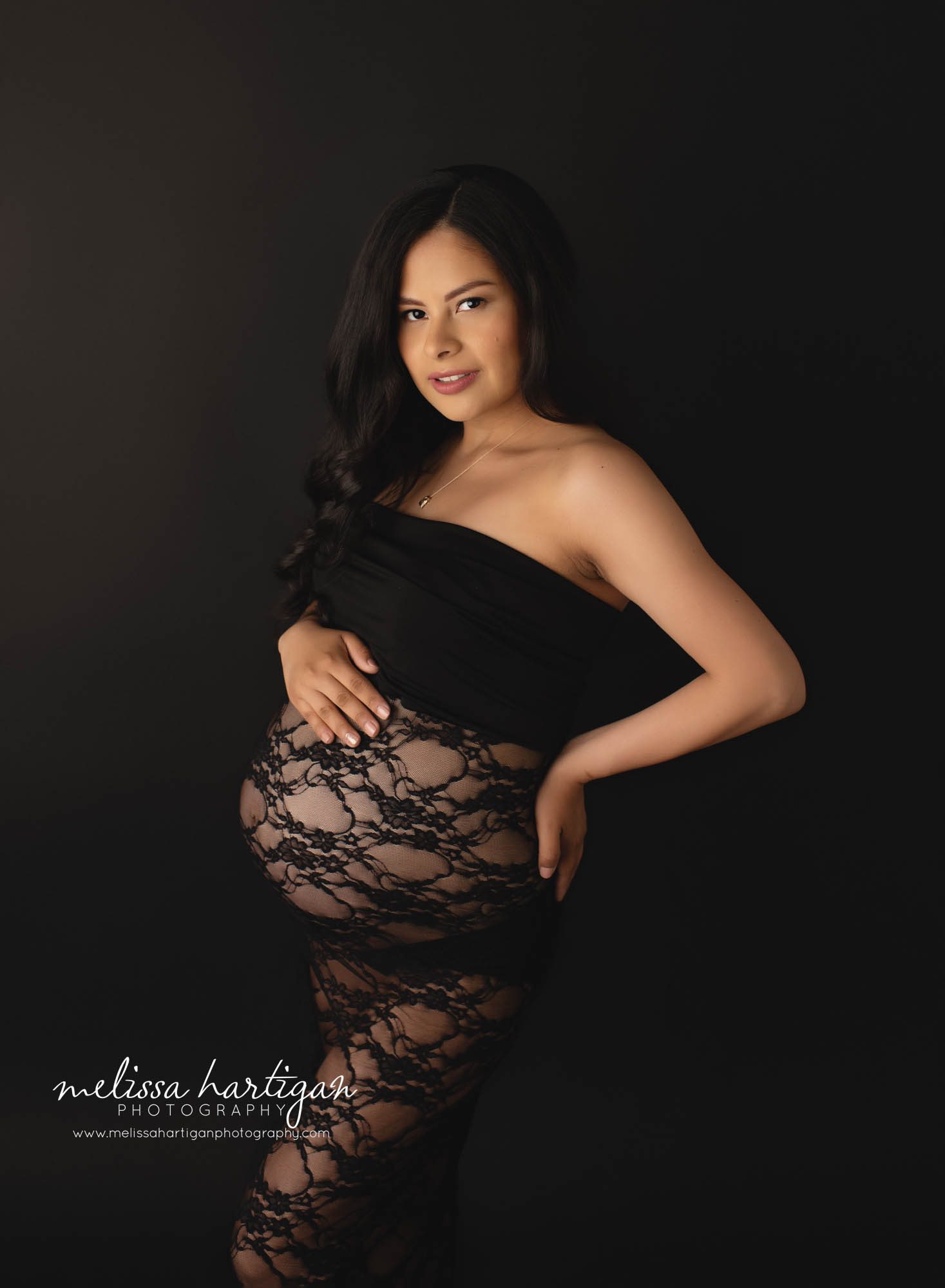pregnant mama wearing black lace maternity gown studio maternity session CT maternity Photographer