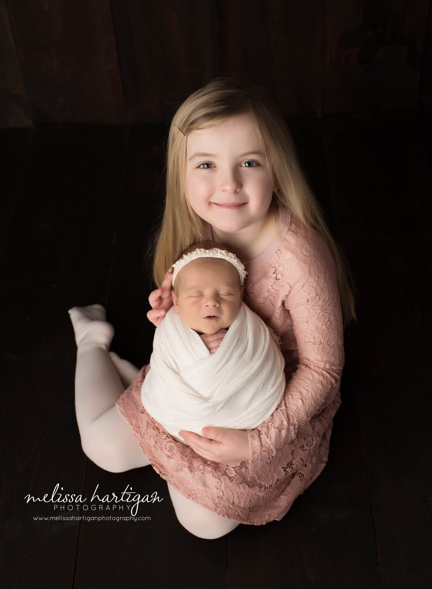 big sister holding baby sister sibling pose CT baby photography