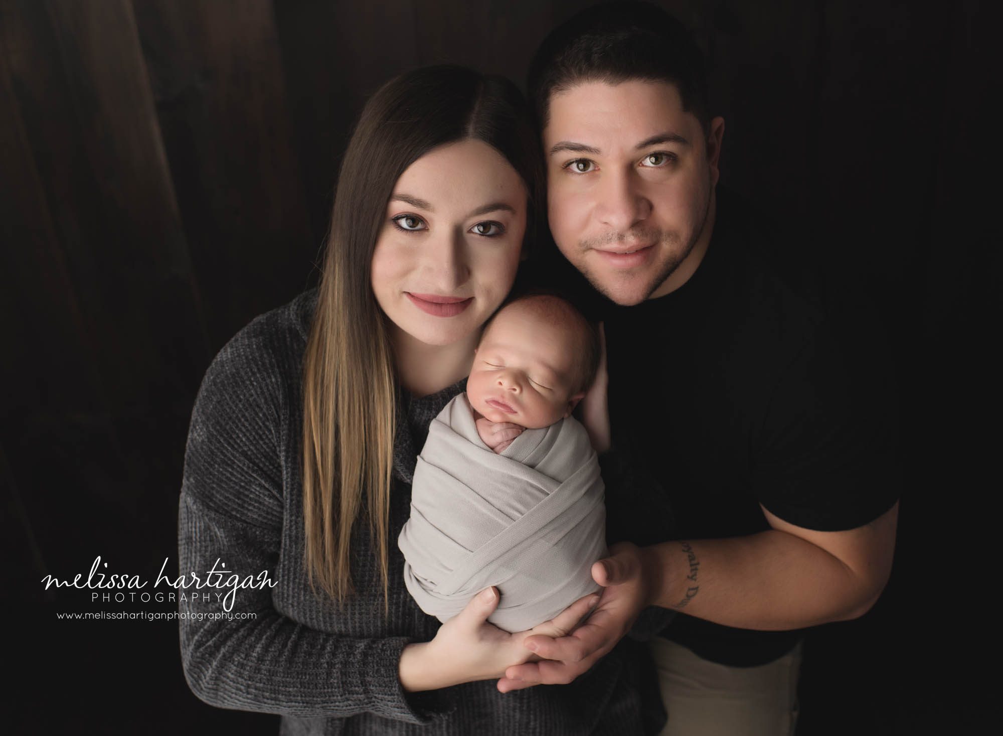 mom dad and newborn son posing for family photography pose ct newborn photographer