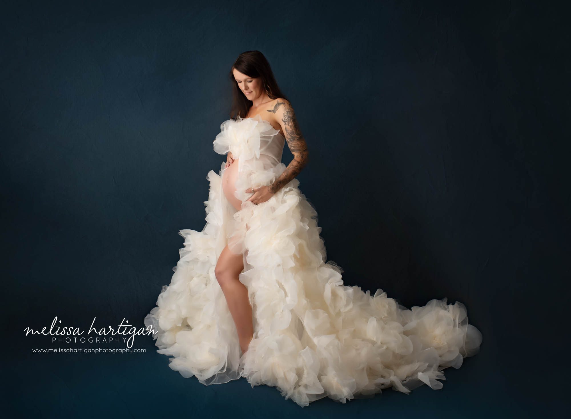 pregant mom to be wearing white tulle maternity gown tolland county maternity photography