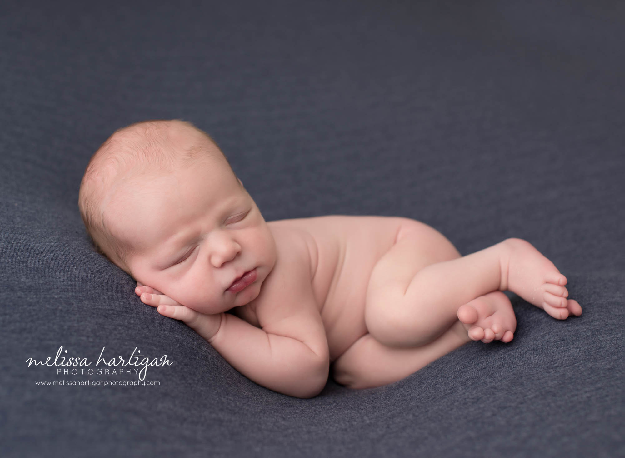 newborn baby boy posed on side CT Newborn Photography Middlesex county