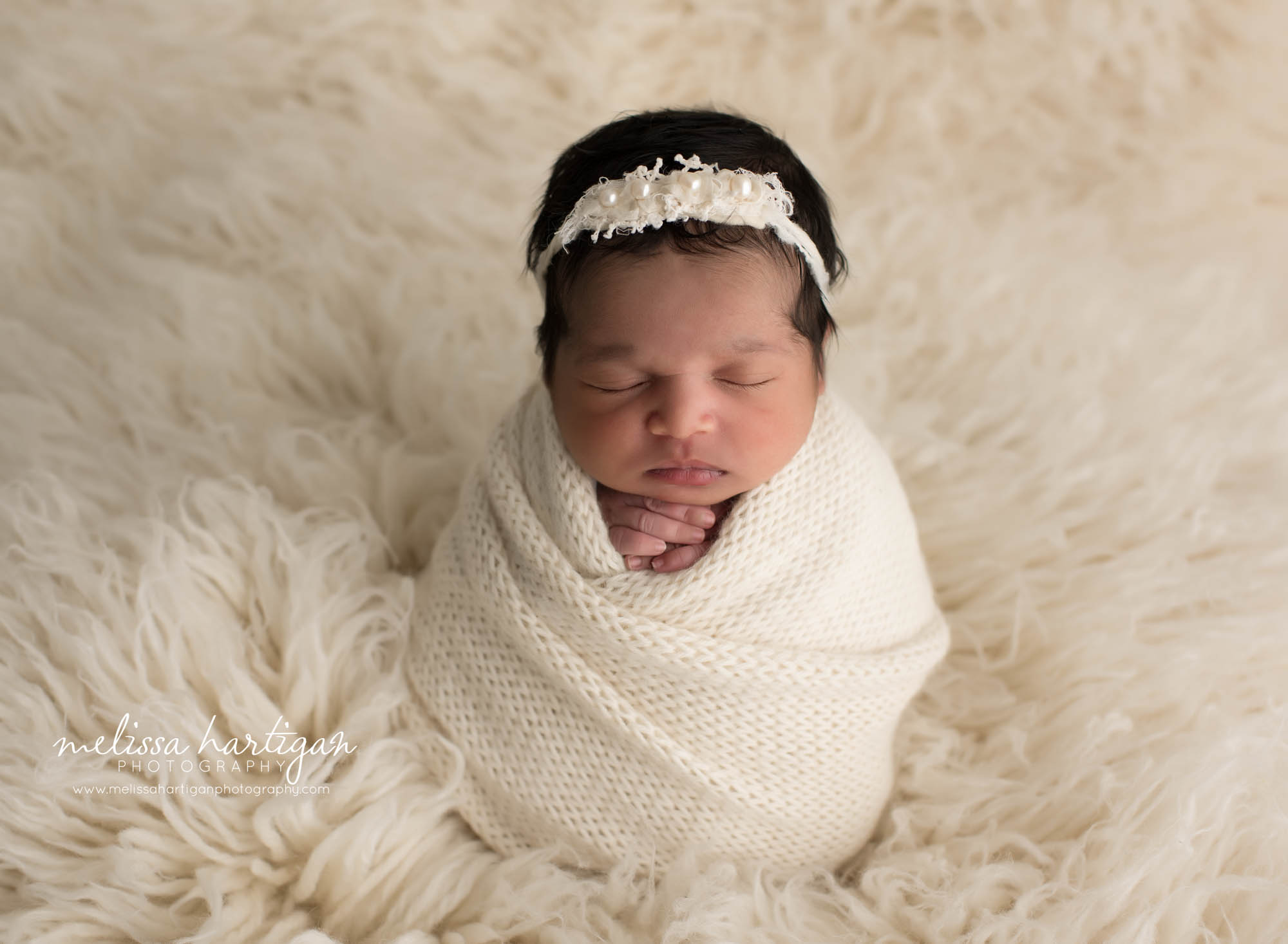 newborn baby girl wrapped in knitted cream wrap with cream headband CT newborn Photography session