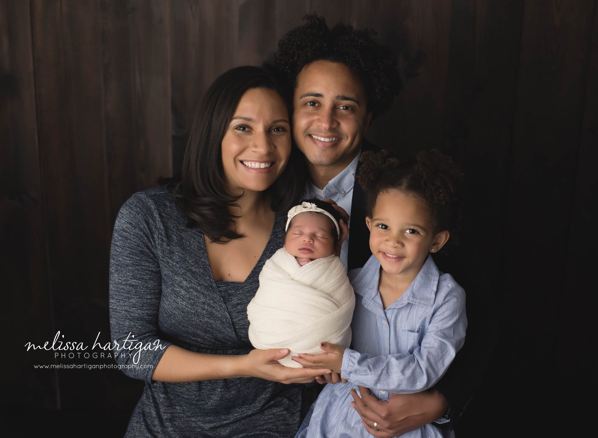 mom dad big sister and new baby girl family photography pose CT newborn Photographer
