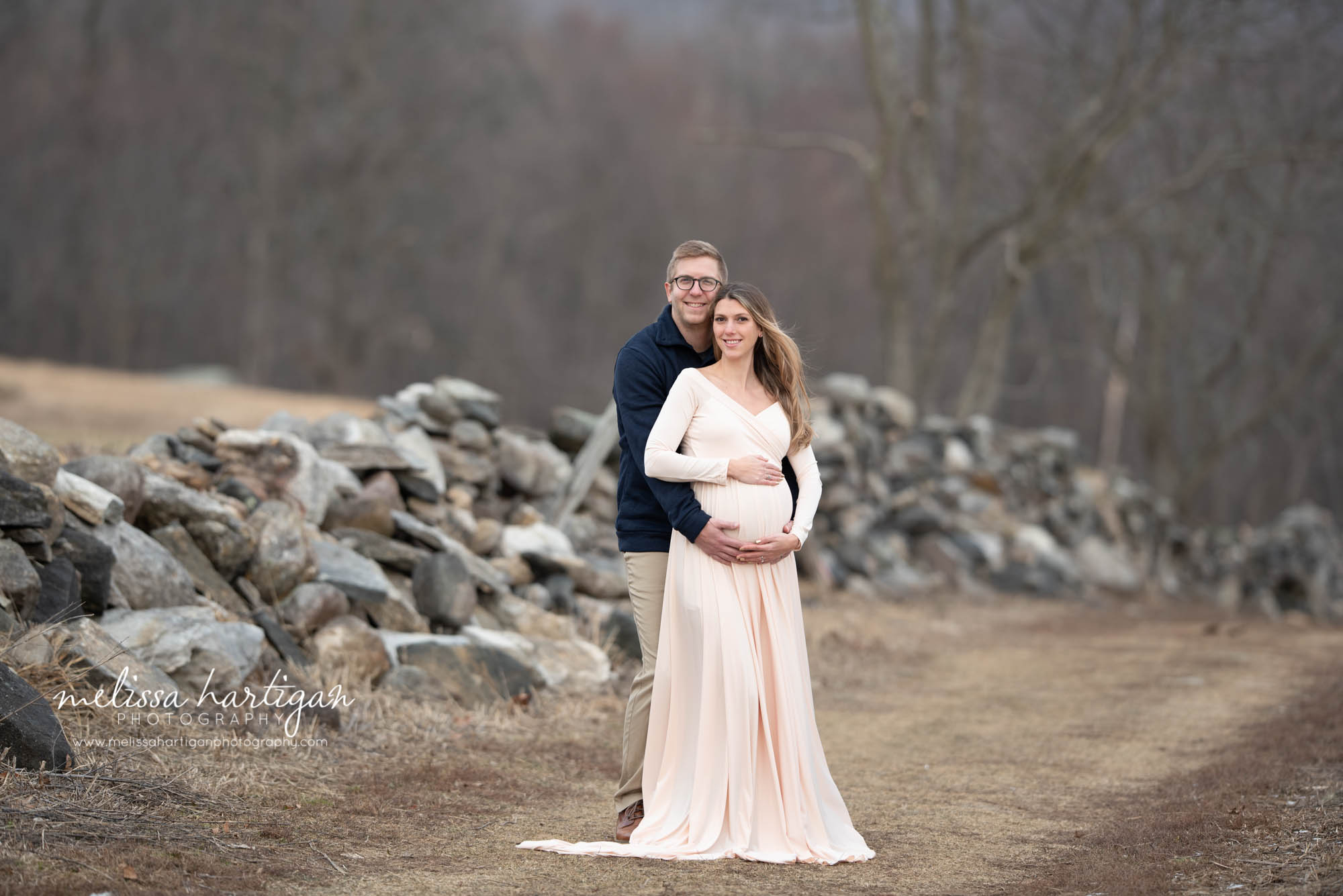 expectant couple holding hands under baby bump maternity photography Danielson CT