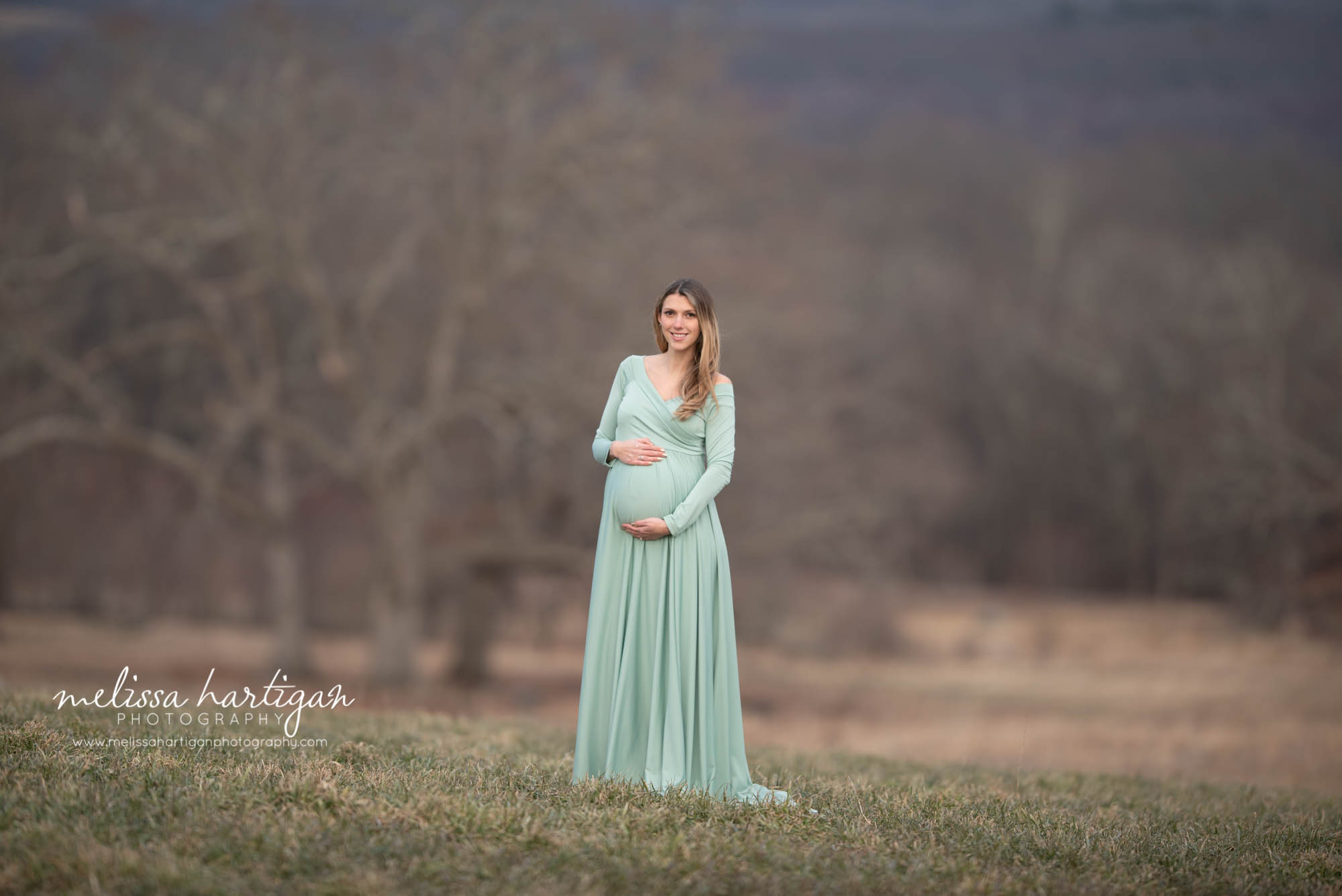 pregnant mom standing maternity photography pose outside maternity pictures CT photography