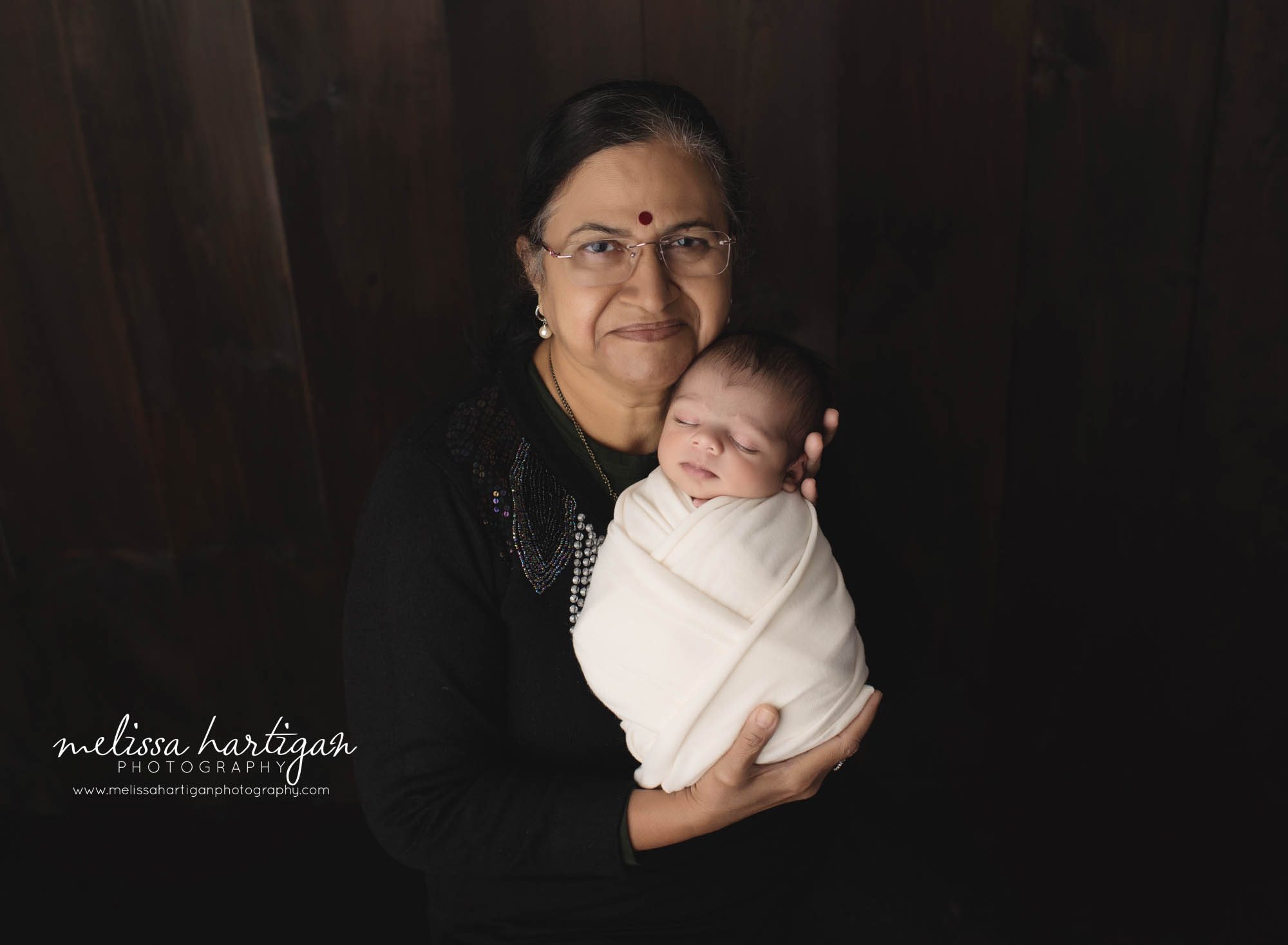 grandma holding newborn grandson family pose newborn photorgaphy session CT newborn photographer