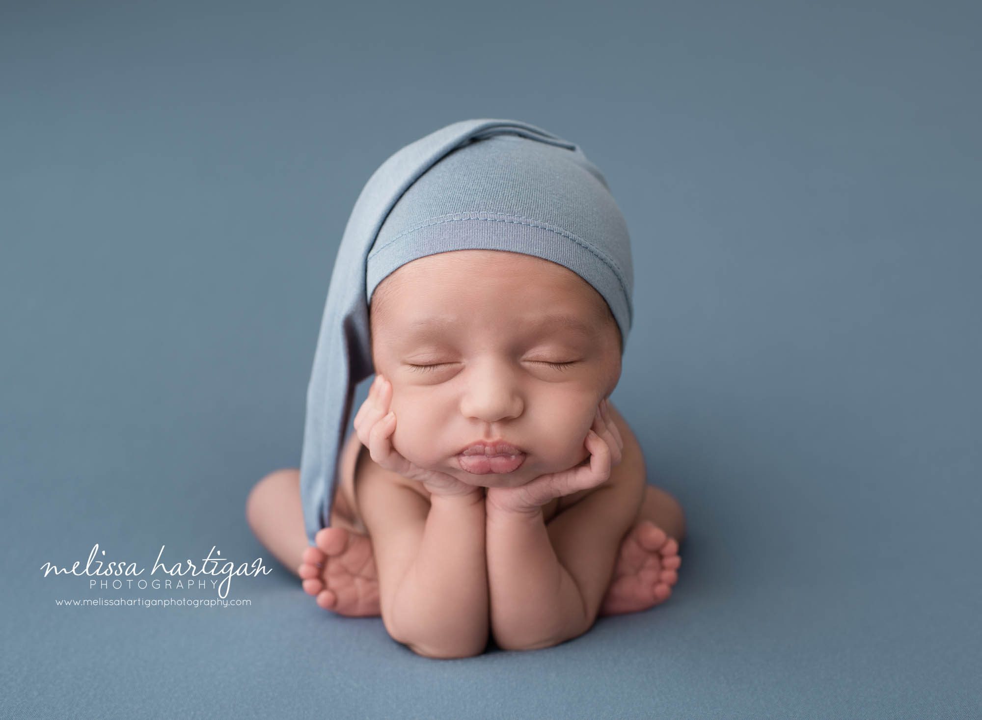 Newborn baby boy posed froggy pose