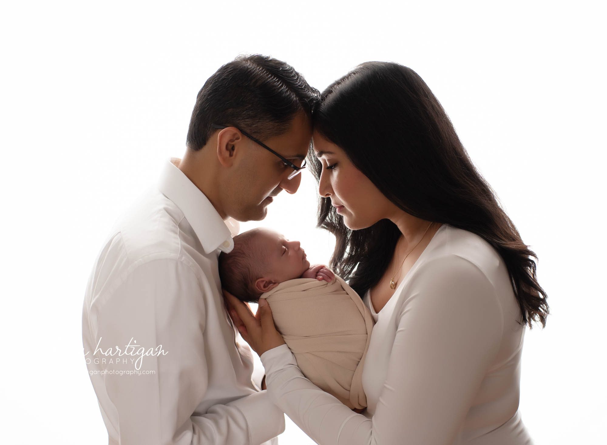 mom dad holding newborn son between them connection parent photo New havent Newborn Photography