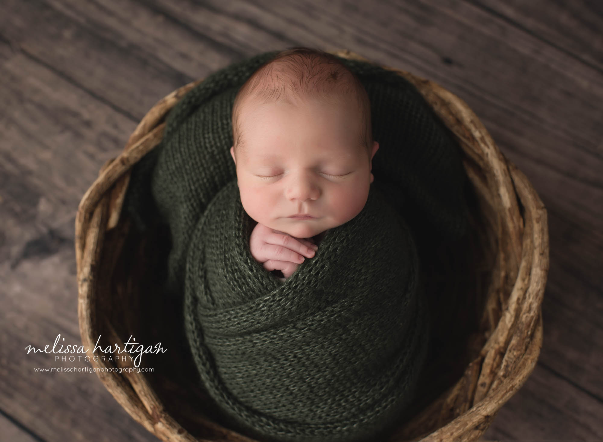 newborn baby boy wrapped in green knitted wrap tolland CT newborn photographer