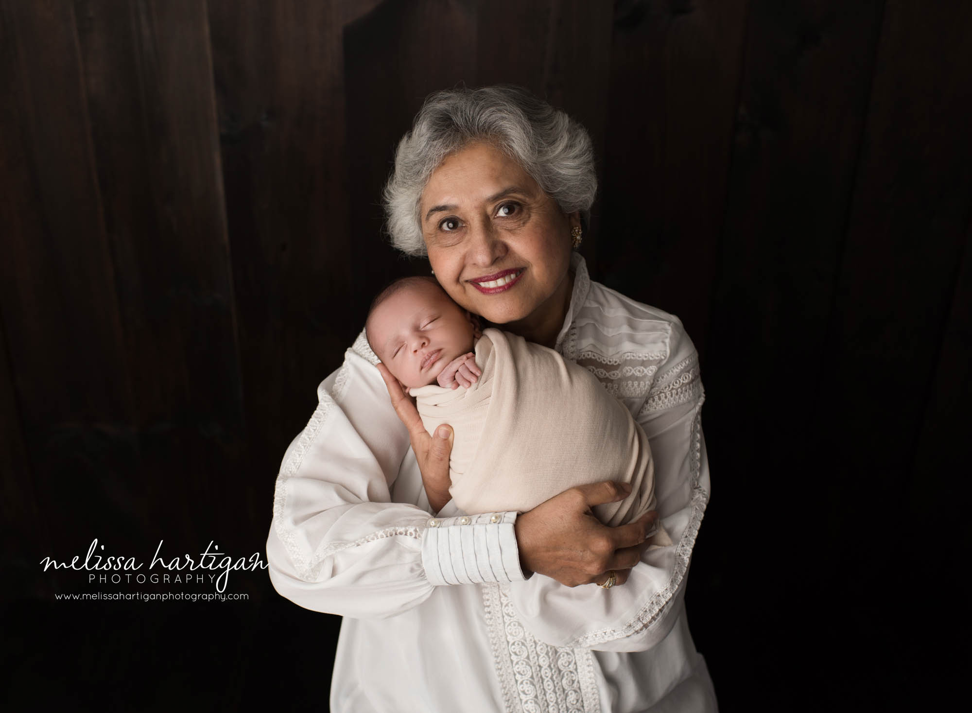 grandma holding newborn grandson family pose newborn photorgaphy session CT newborn photographer