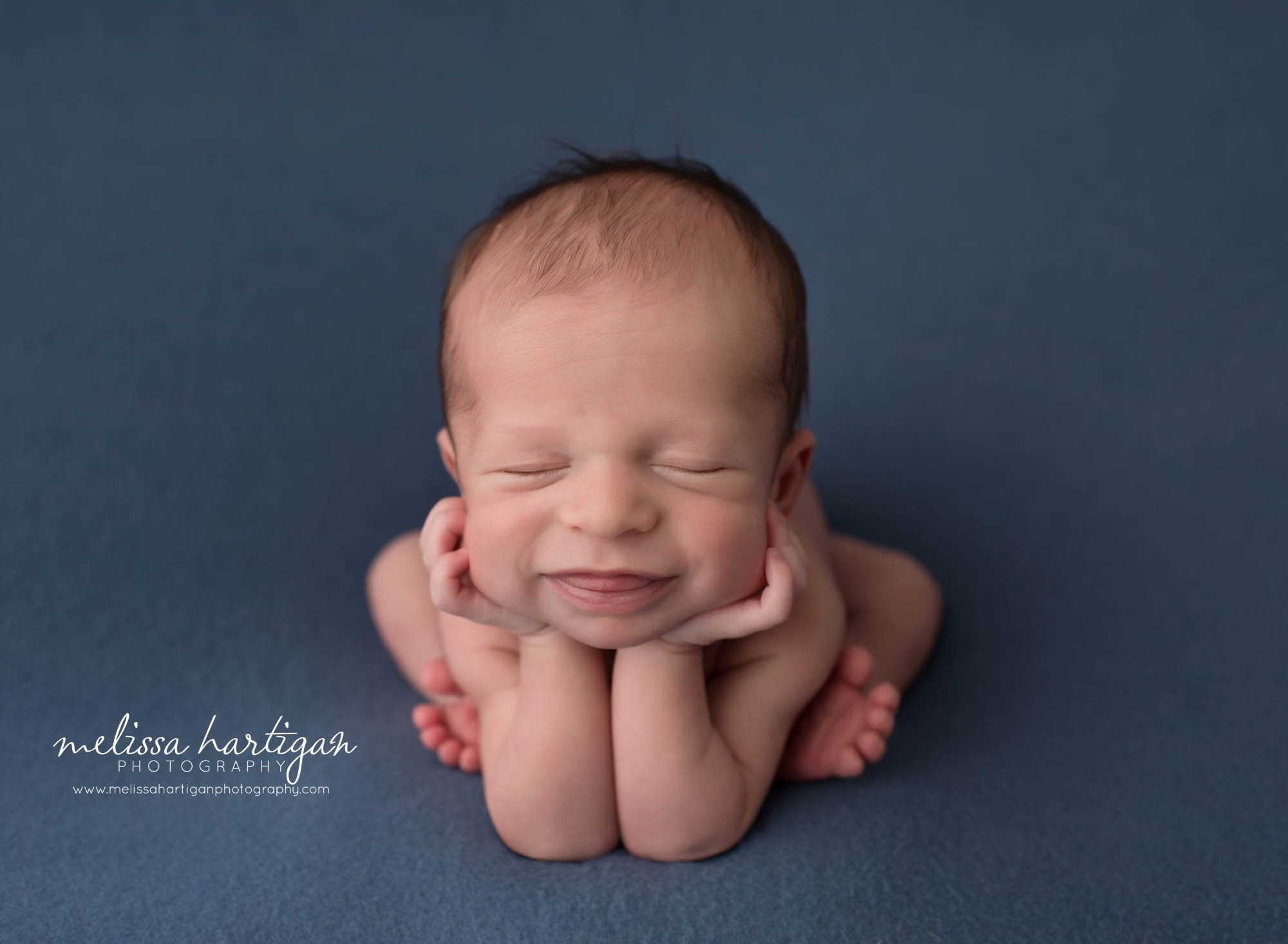 newborn baby boy posed froggy pose smiling maternity newborn photography new Hartford CT
