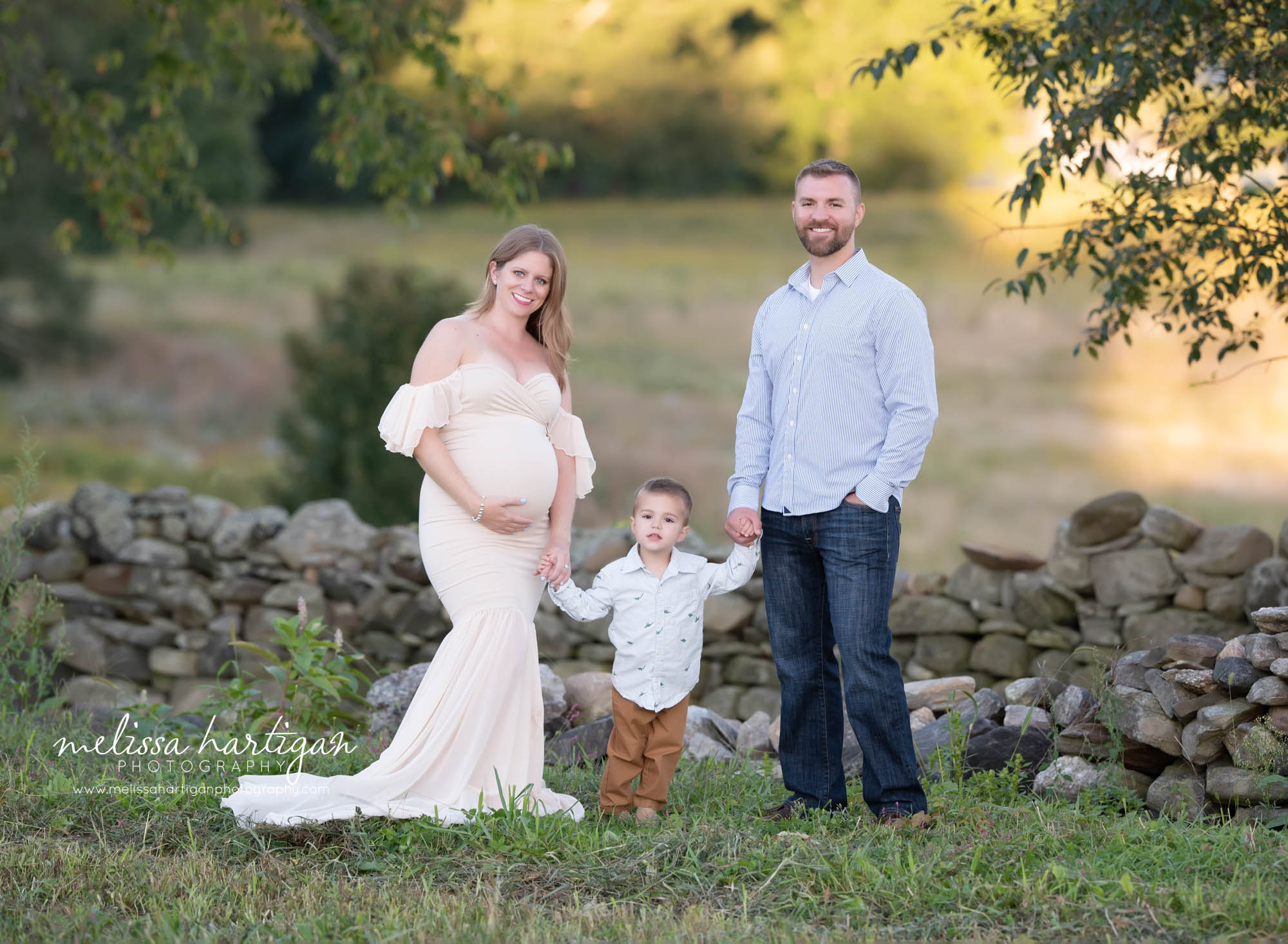 mom dad and son family maternity picture 