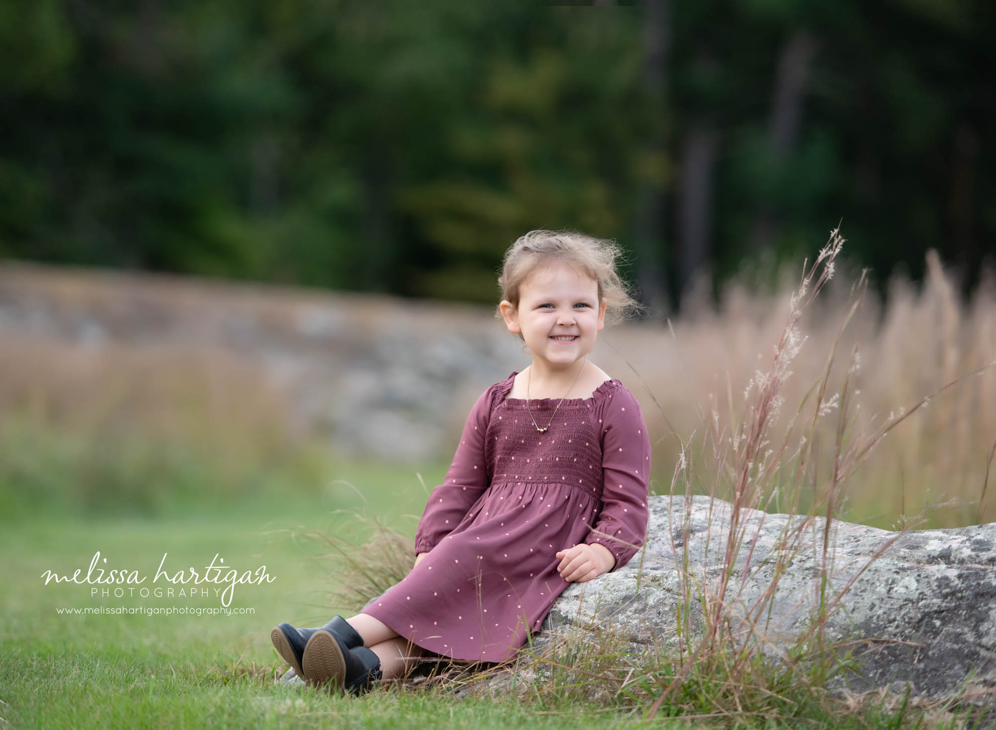 little girl sitting on a rock family photographer connecticut