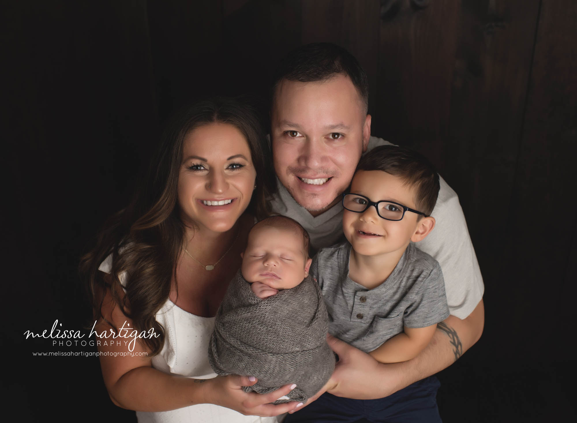 mom dad and their two sons family photo newborn photography CT