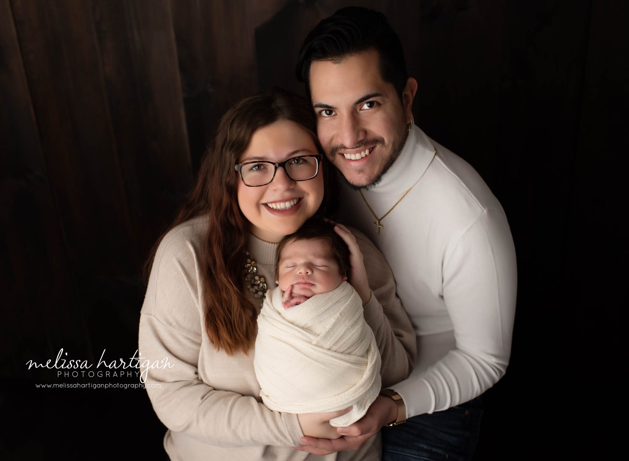 mom dad holding newborn baby boy parent pose newborn photography CT session