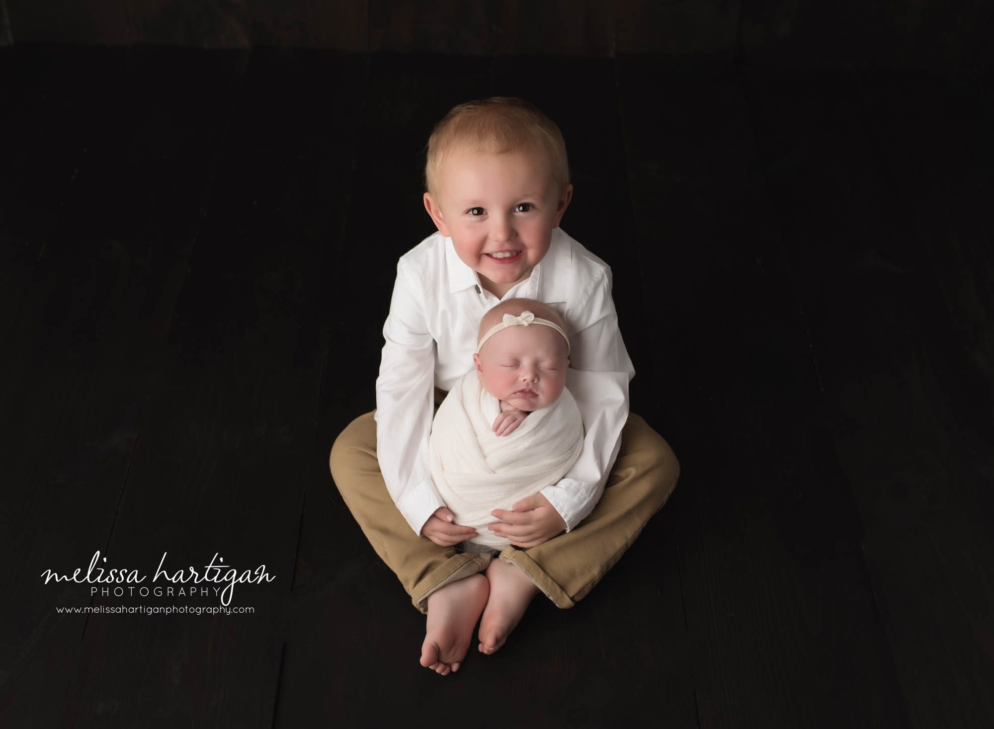 newborn baby girl posed with big brother baby photography CT