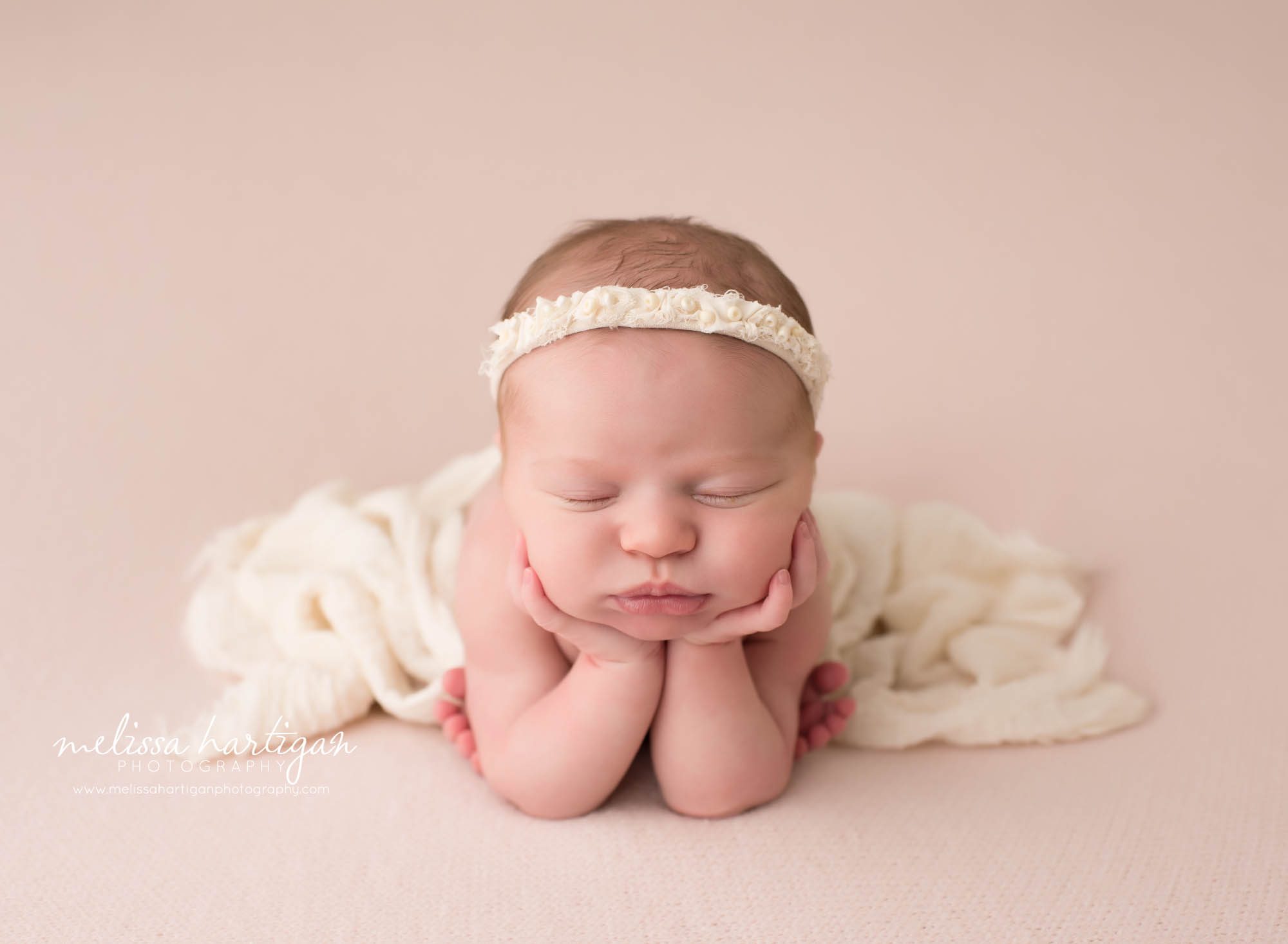 newborn baby girl posed on light pink posed froggy pose newborn photography marlborough CT