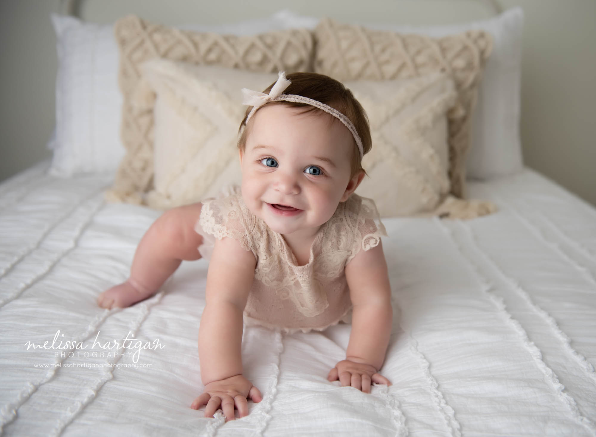 baby girl crawling on bed