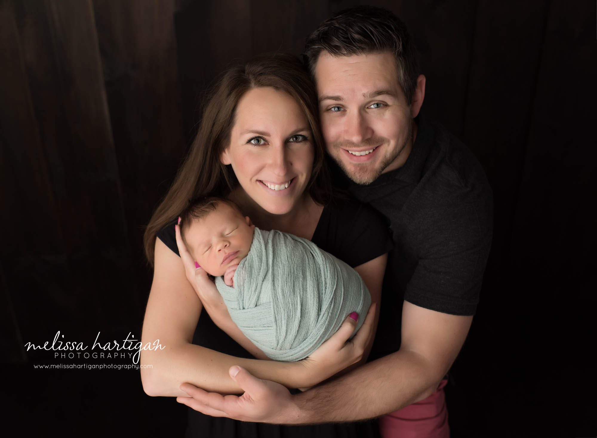 newborn baby boy posed with mom and dad parents pose newborn photography Avon CT