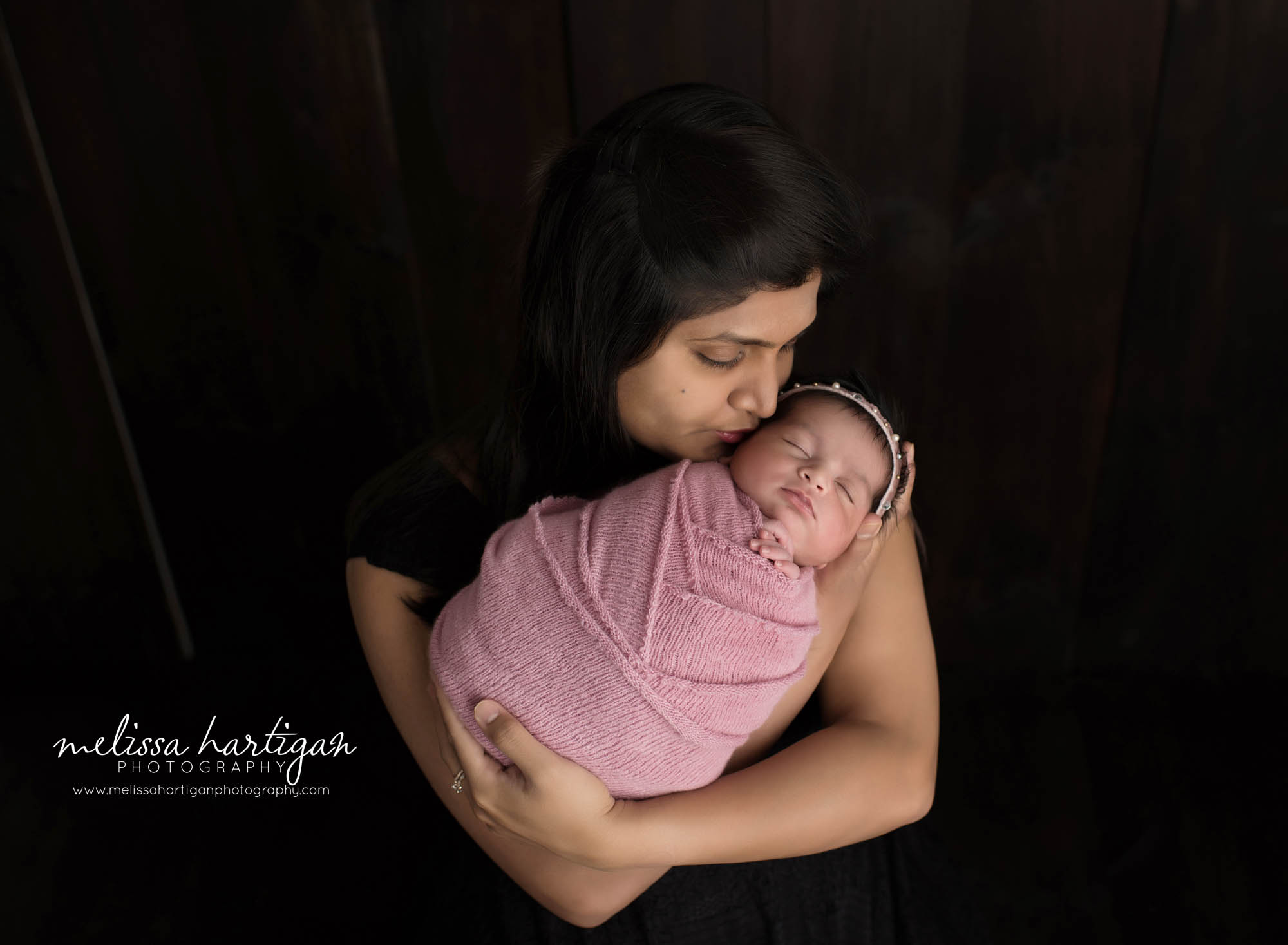 mom holding newborn daughter in parents pose newborn photography windsor locks