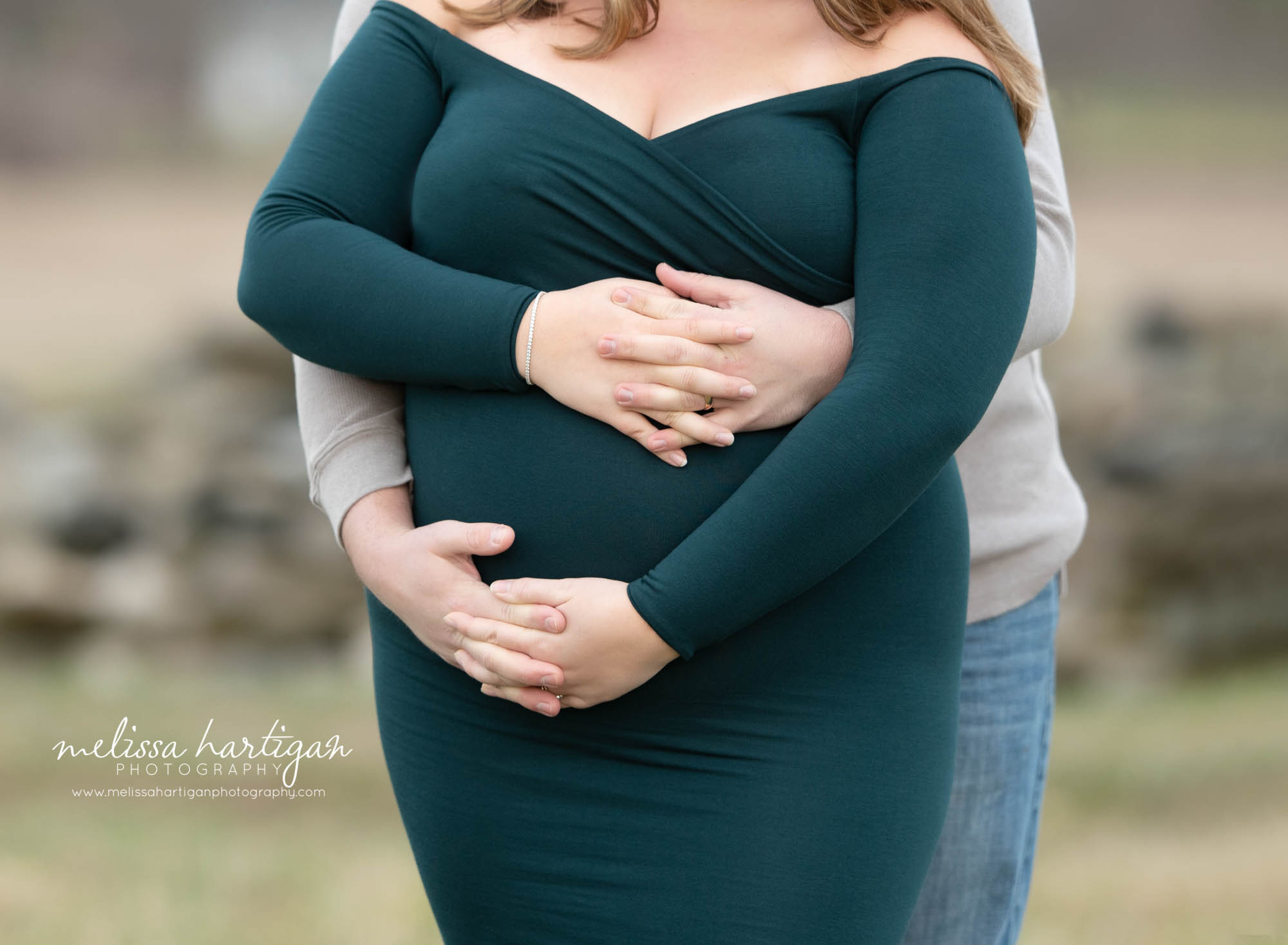couple expecting baby holding hands around baby bump maternity photography Amston CT