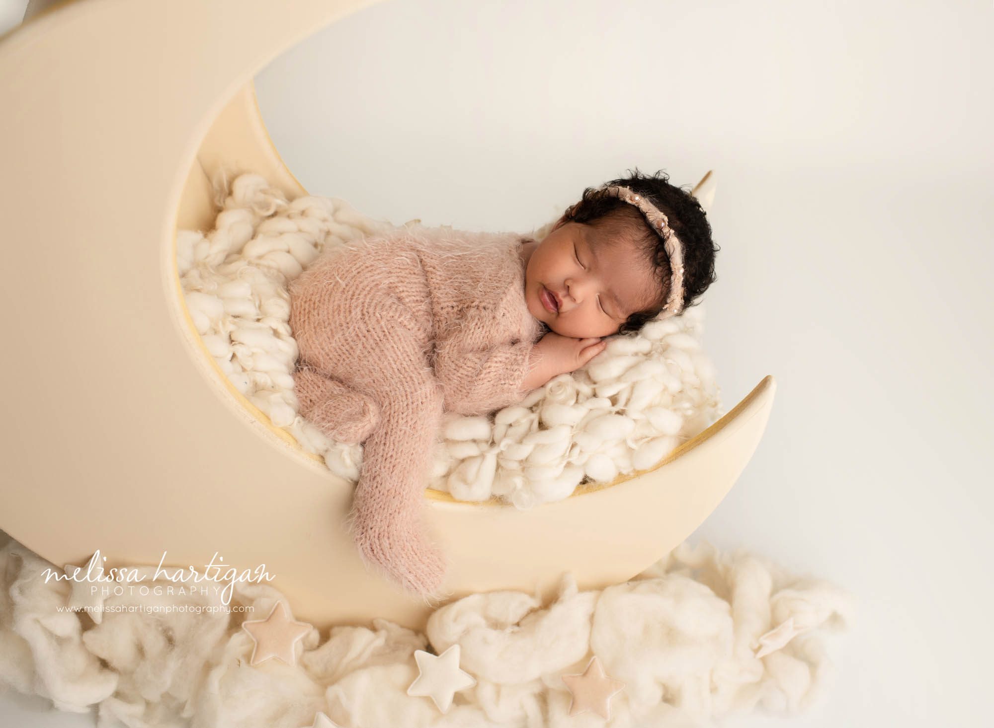 newborn baby girl posed on wooden newborn moon prop newborn photography CT