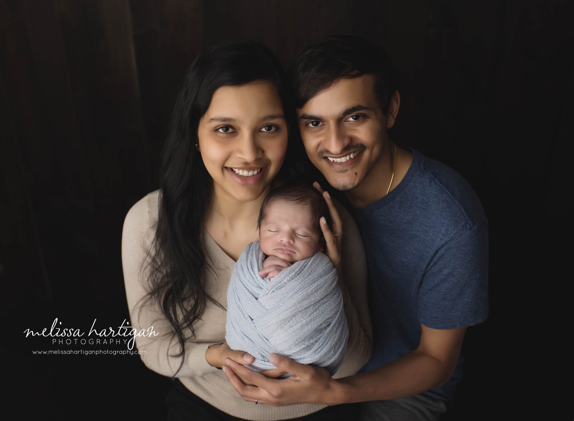 mom dad and newborn son in family pose newborn photography glastonbury ct