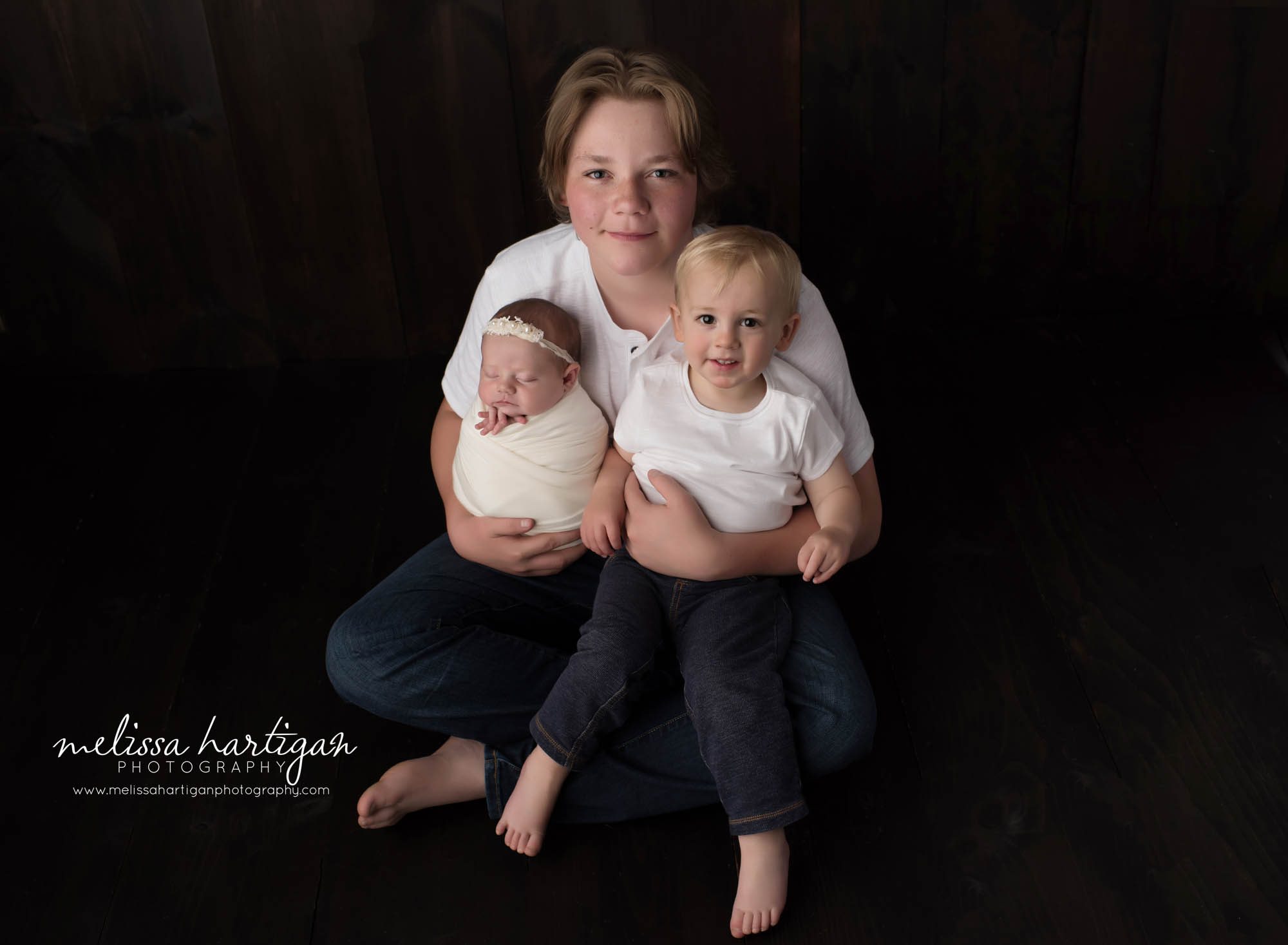 newborn baby girl posed sibling pose with two older brothers family picture newborn photography hartford county