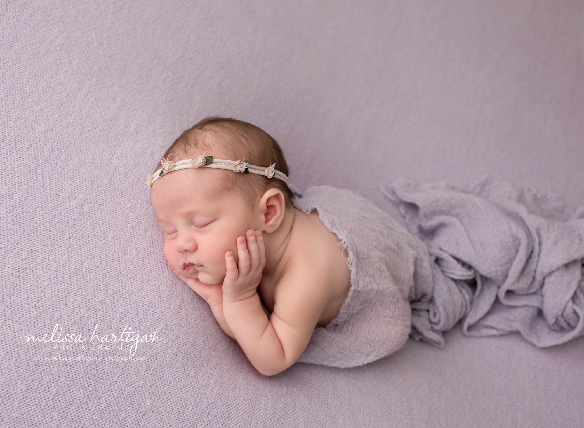 newborn baby girl posed on purple lavender backdrop posed timber pose newborn photography CT