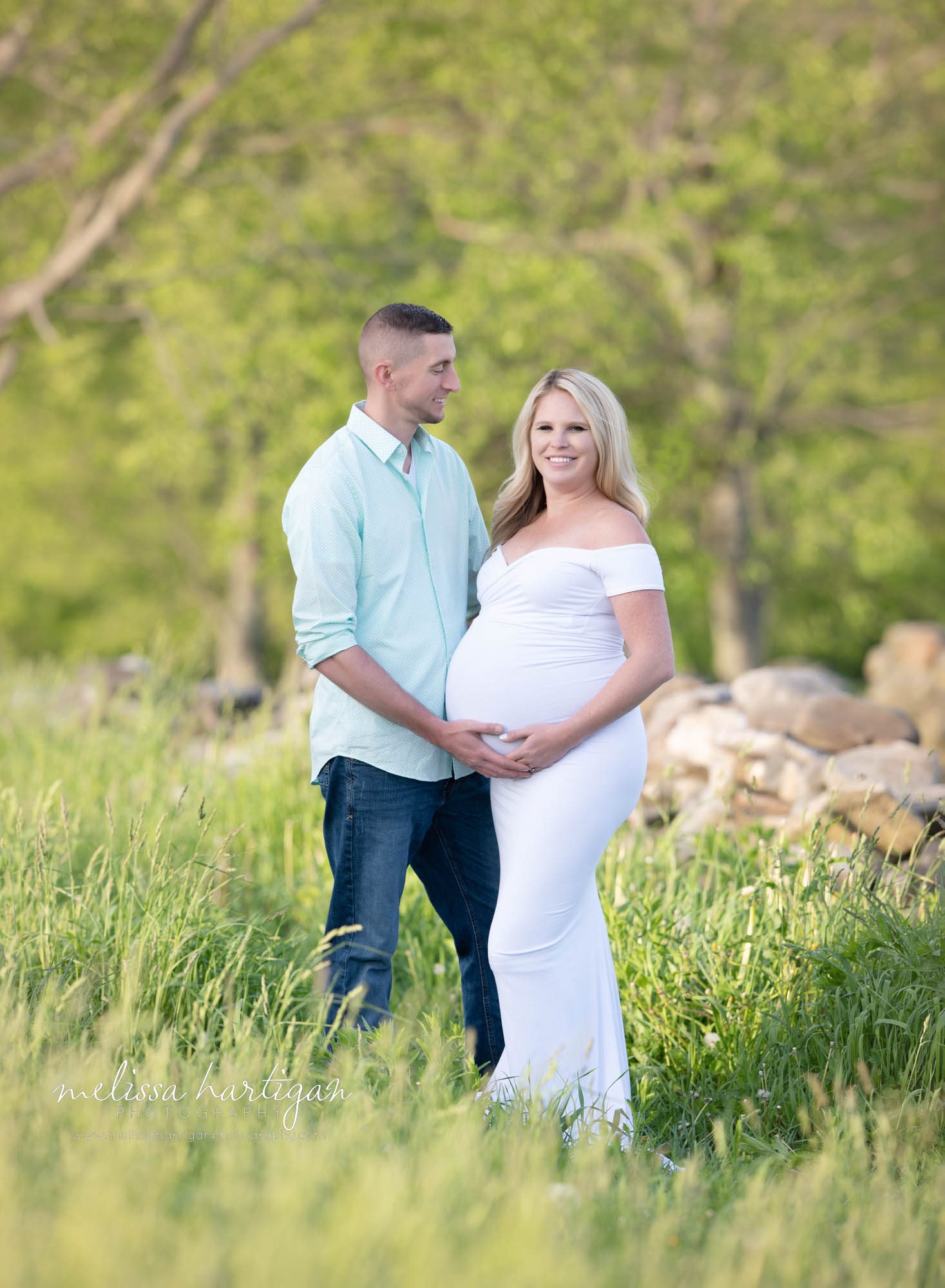 happy couple standing maternity photography CT