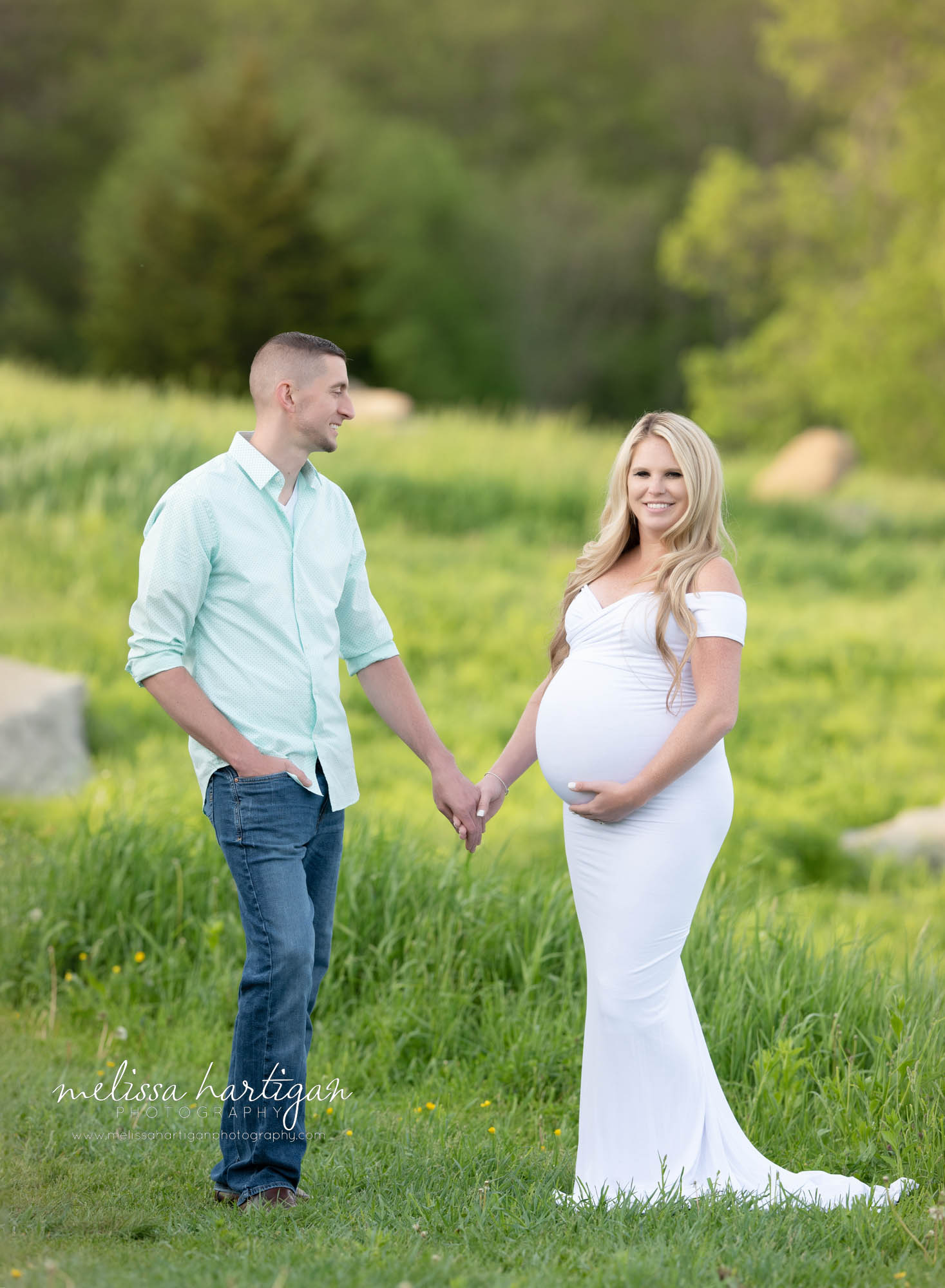 couple holding hands mom holding baby bump maternity photography south windsor CT