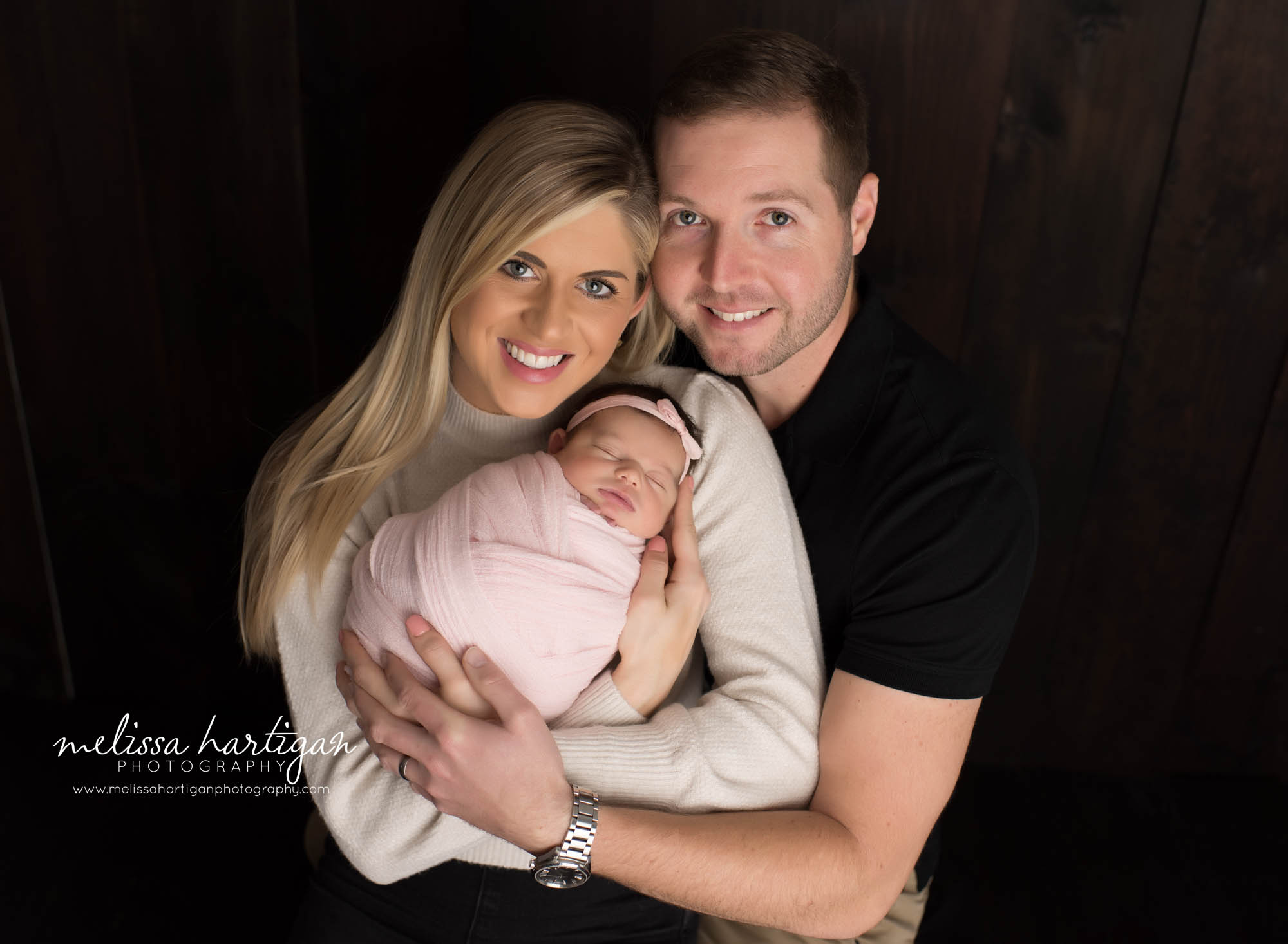 mom dad and newborn baby girl posed family pose CT newborn photography