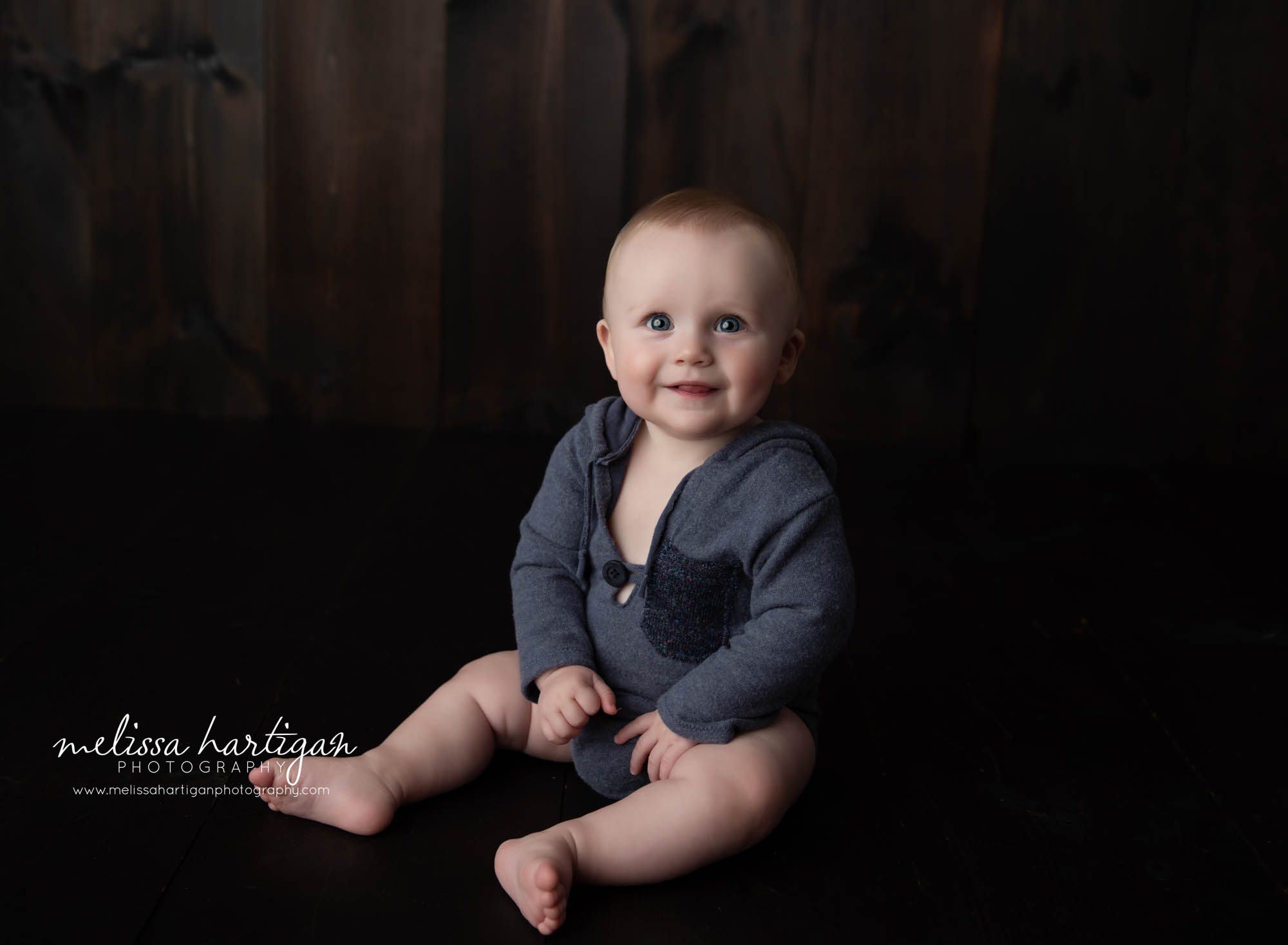 baby boy wearing blue outfit sitting up by himself baby milestone photography tolland county CT