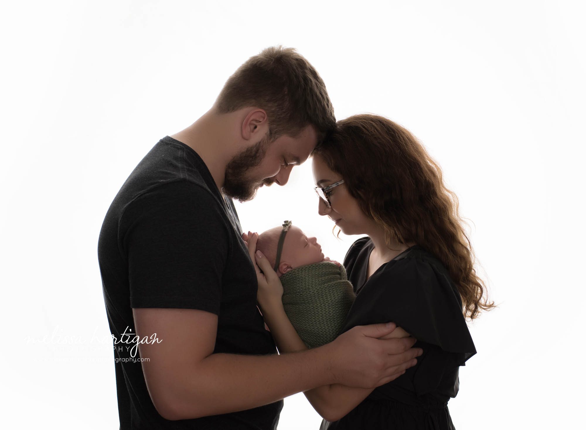 mom dad holding newborn daughter facing with foreheads together tolland CT baby photography