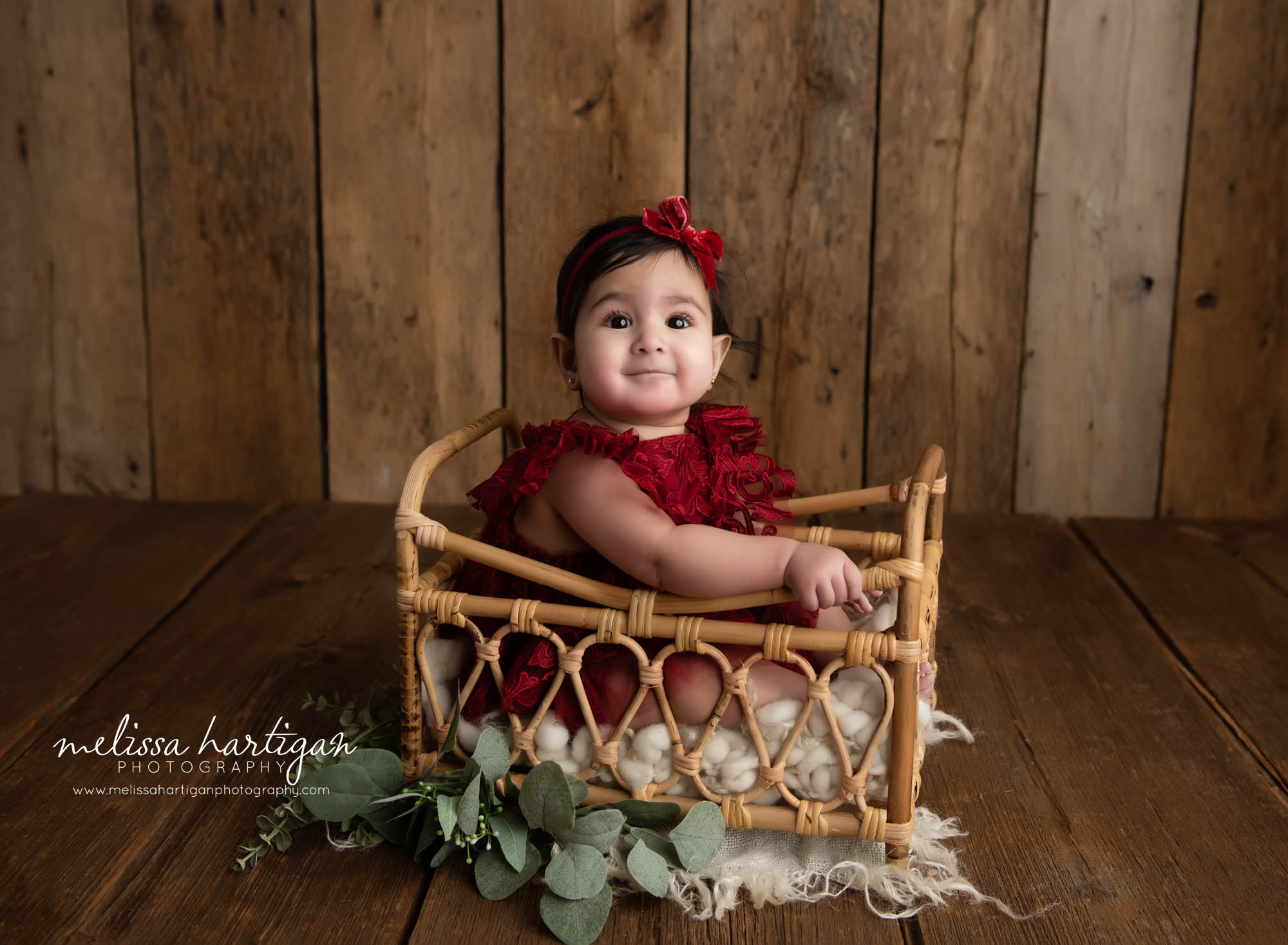 baby girl sitting in basket in studio baby milestone photography CT session