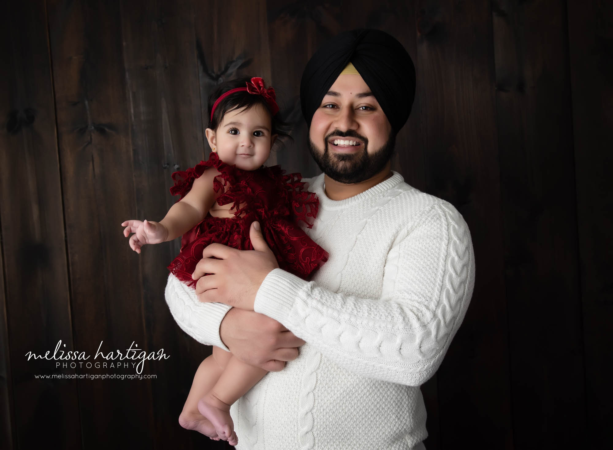 dad holding baby girl parents pose milestone photography CT