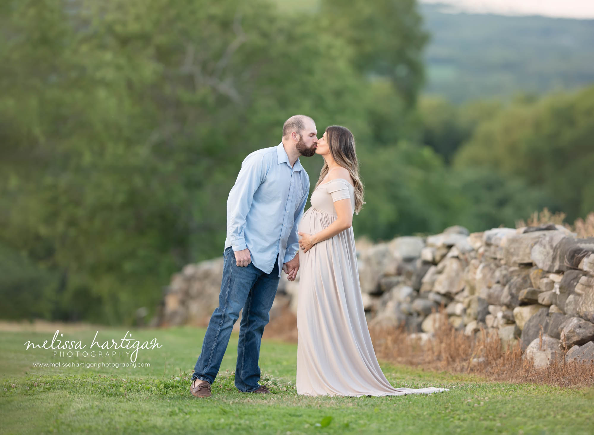 mom to-be and dad to be kissing maternity photography CT