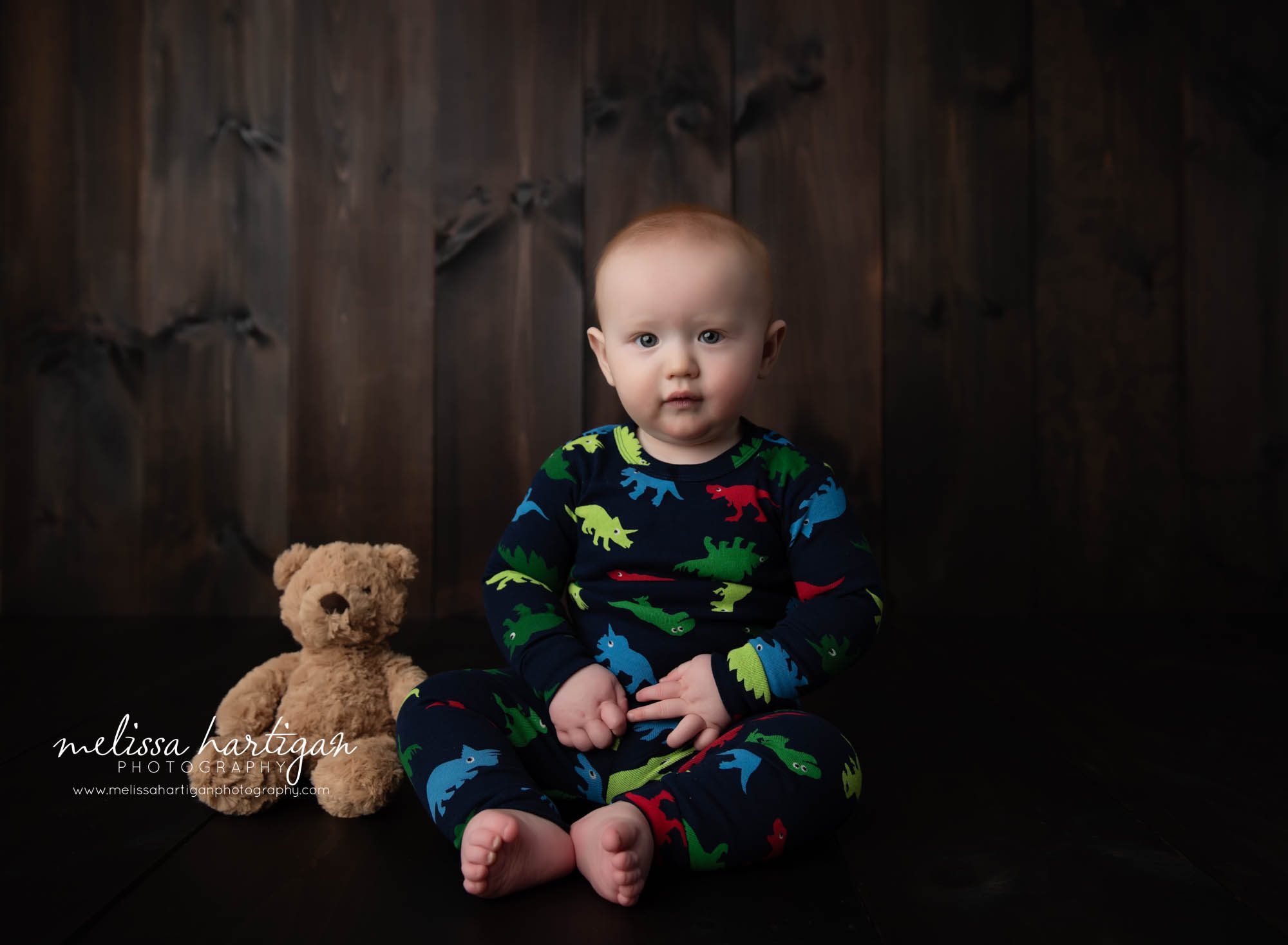 baby boy sitting on floor with teddy bear beside him CT baby milestone photographer