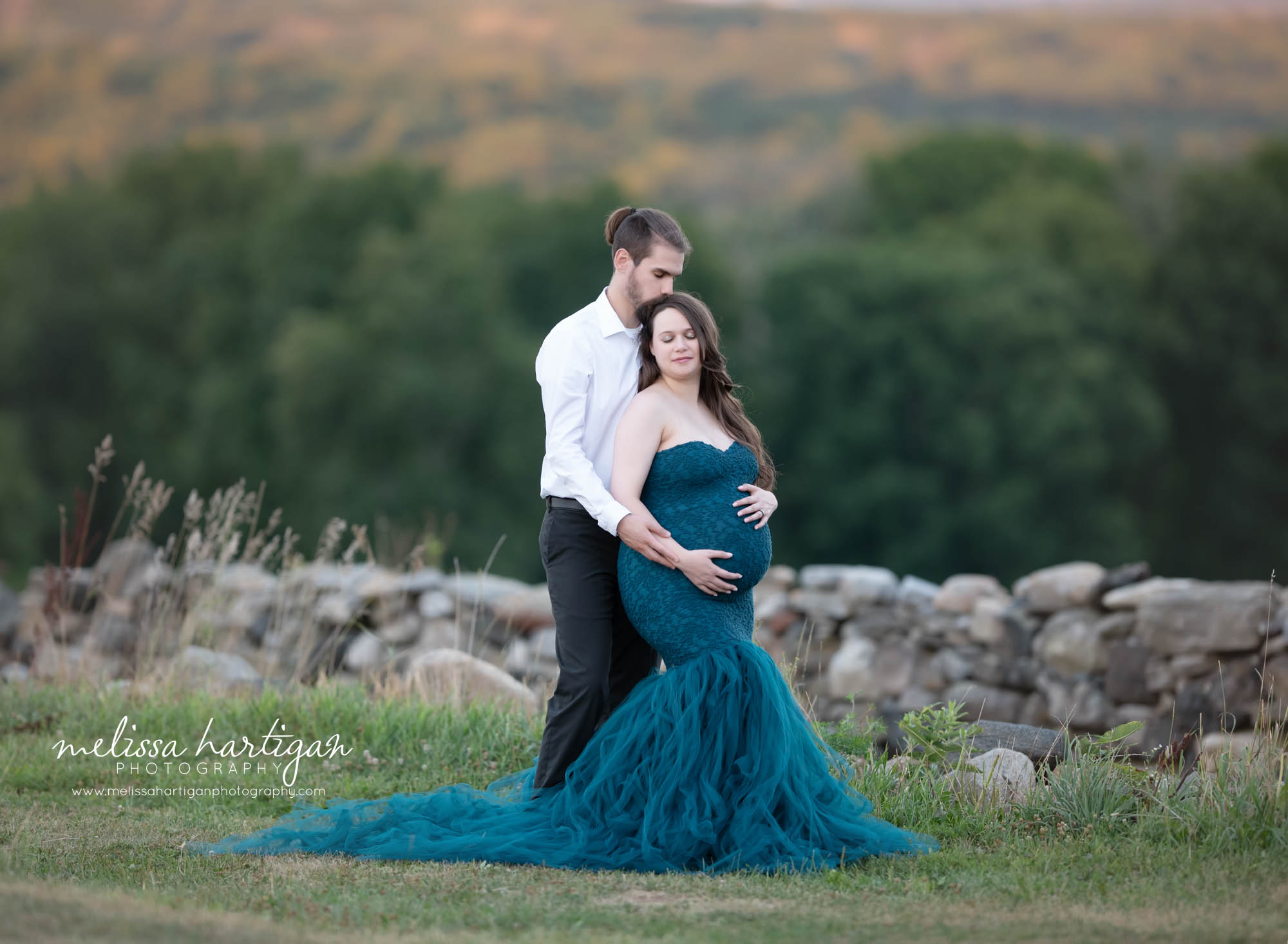 pregnant mom and dad standing holding baby bump CT maternity photography session