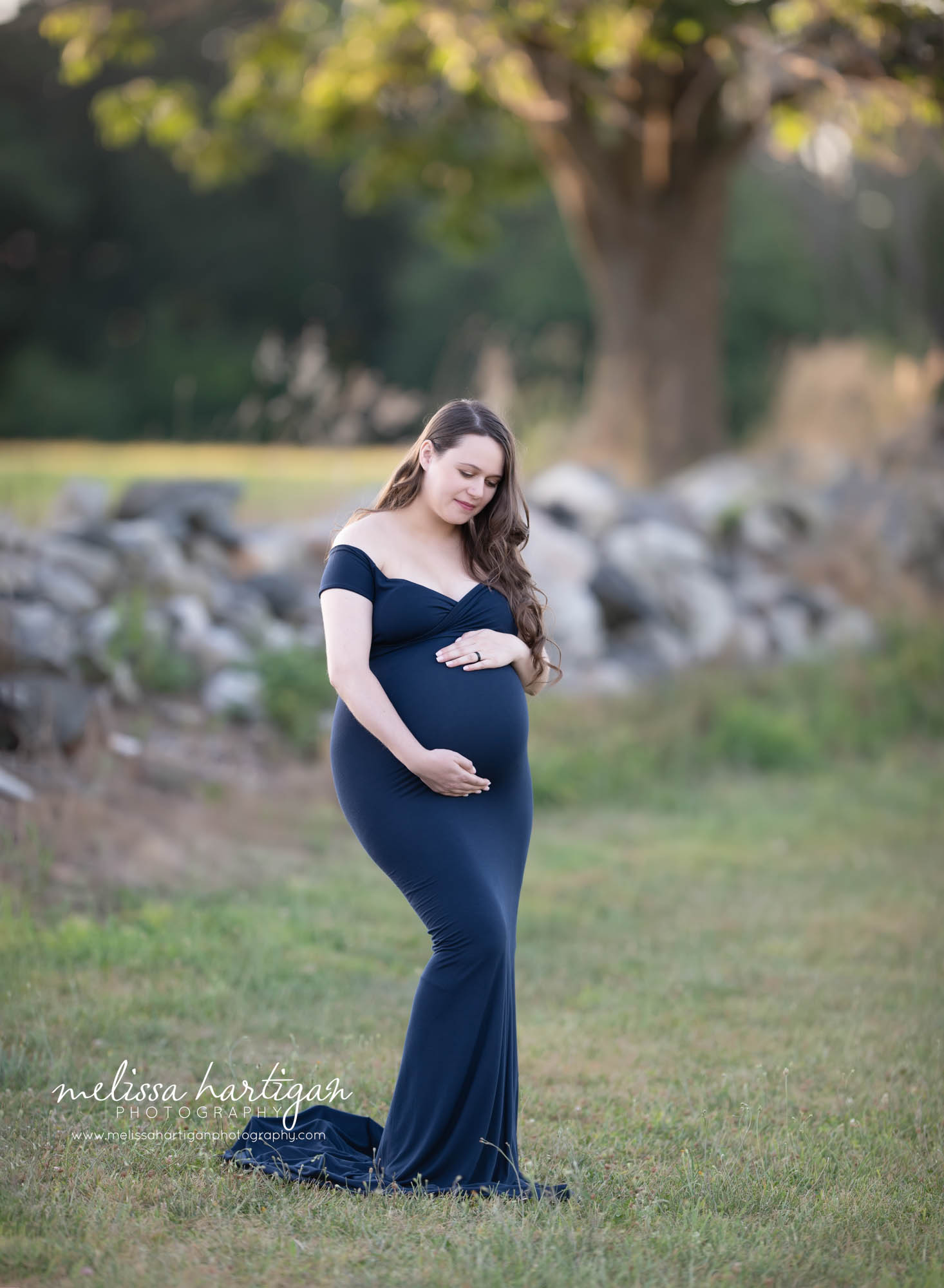 pregnant mom-to-be wearing navy blue long form fitting maternity dress maternity photography CT