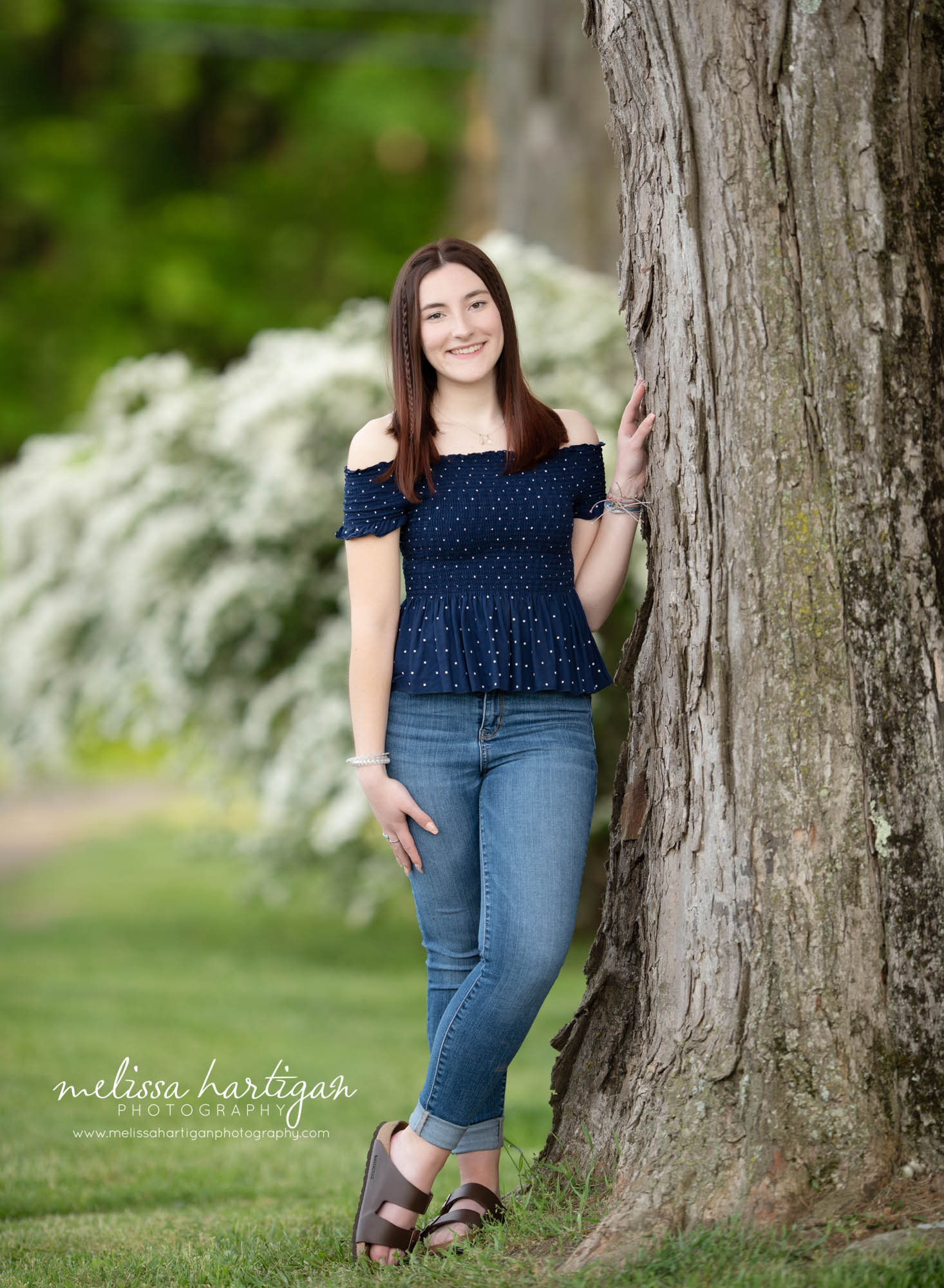 senior teen standing next to tree CT senior portrait photography pose