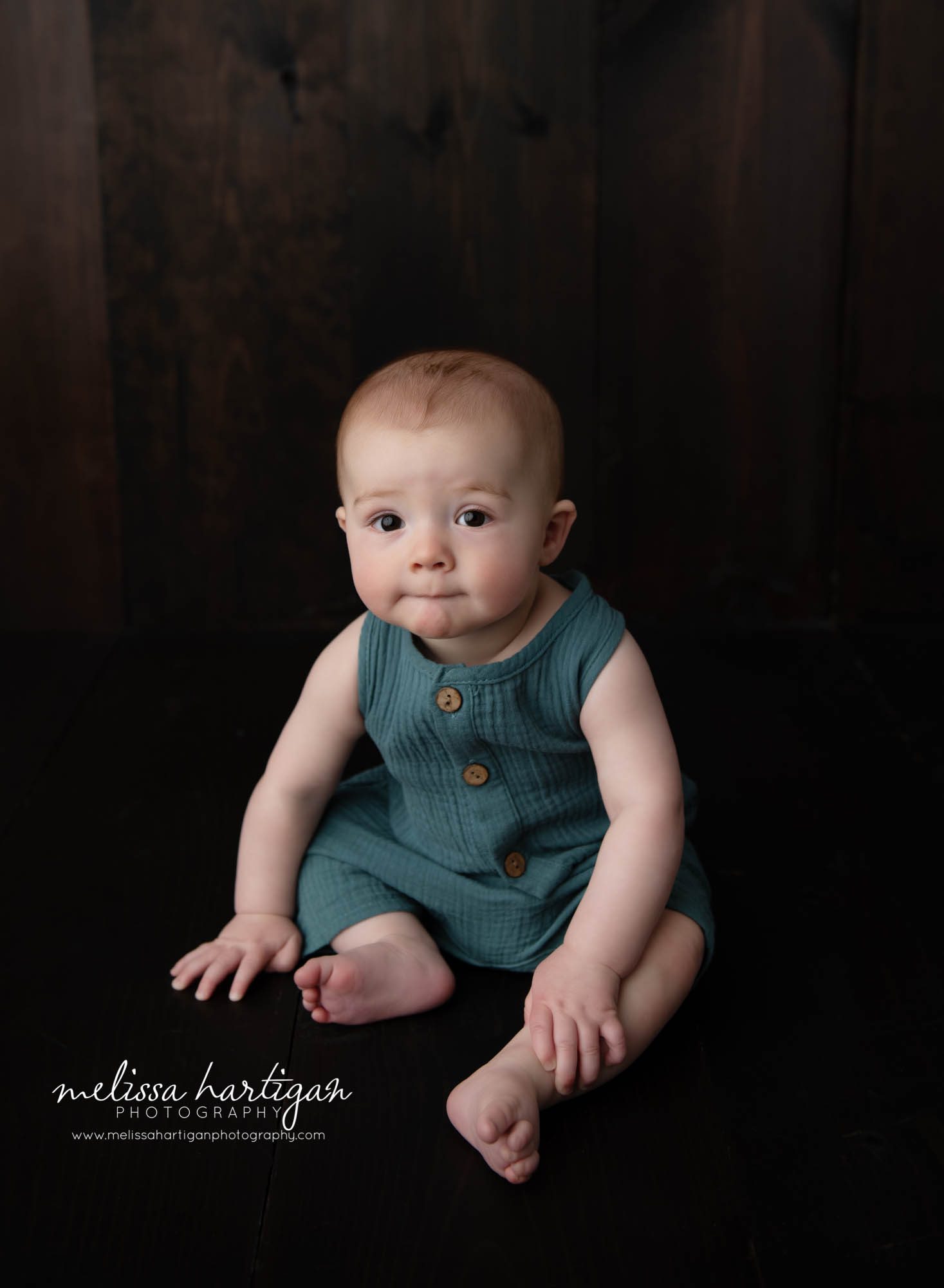 baby boy sitting up on wooden boards in CT photography studio hartford county baby photography