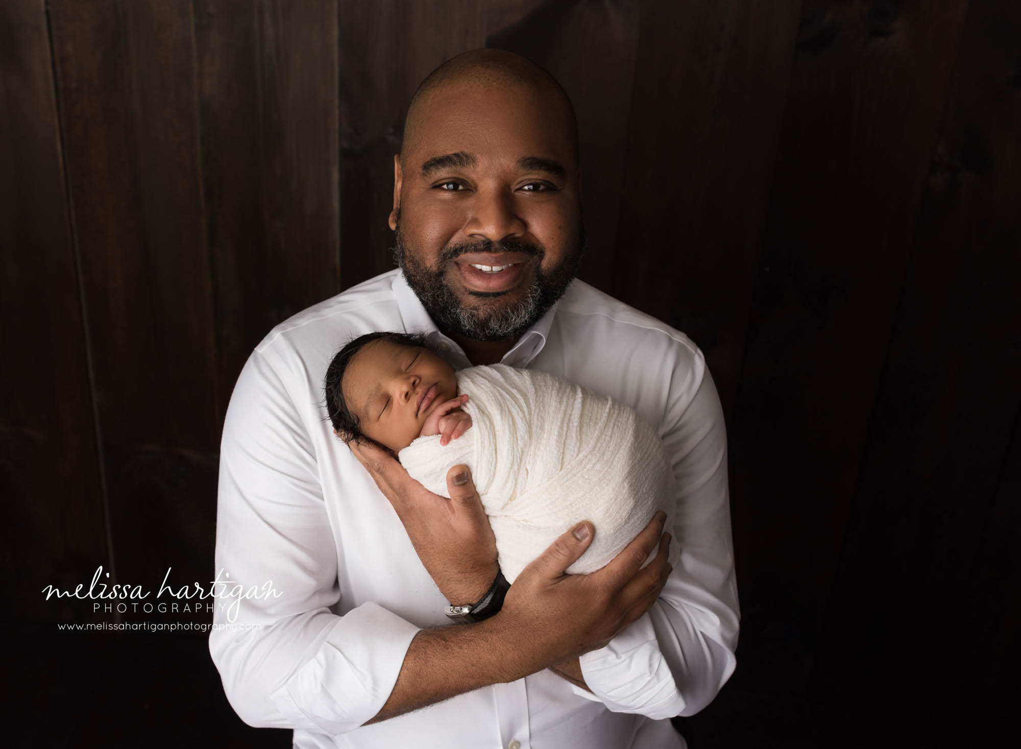 hold holding newborn son parent pose baby photography ct