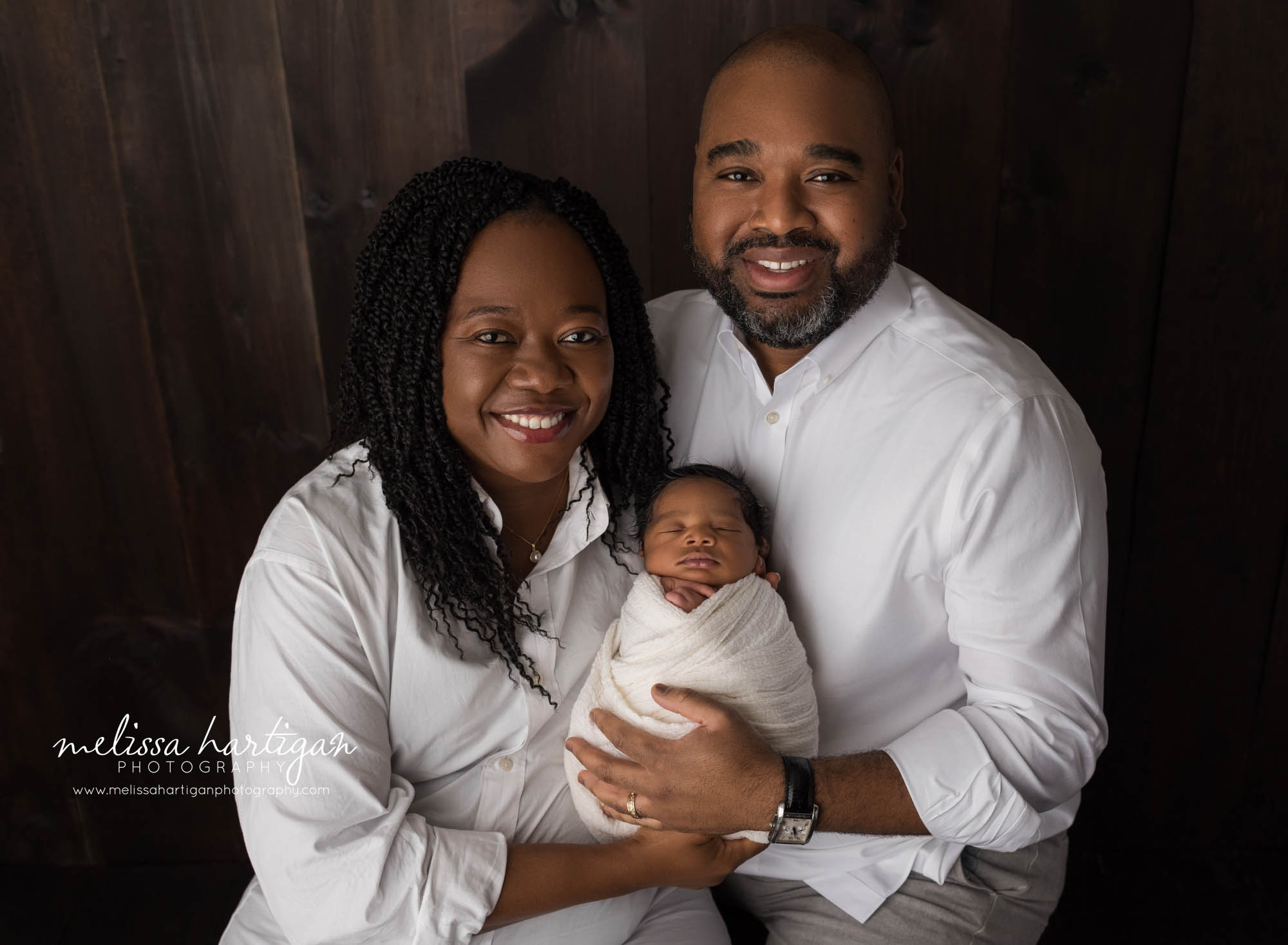 mom dad and newborn son family pose newborn photography milford