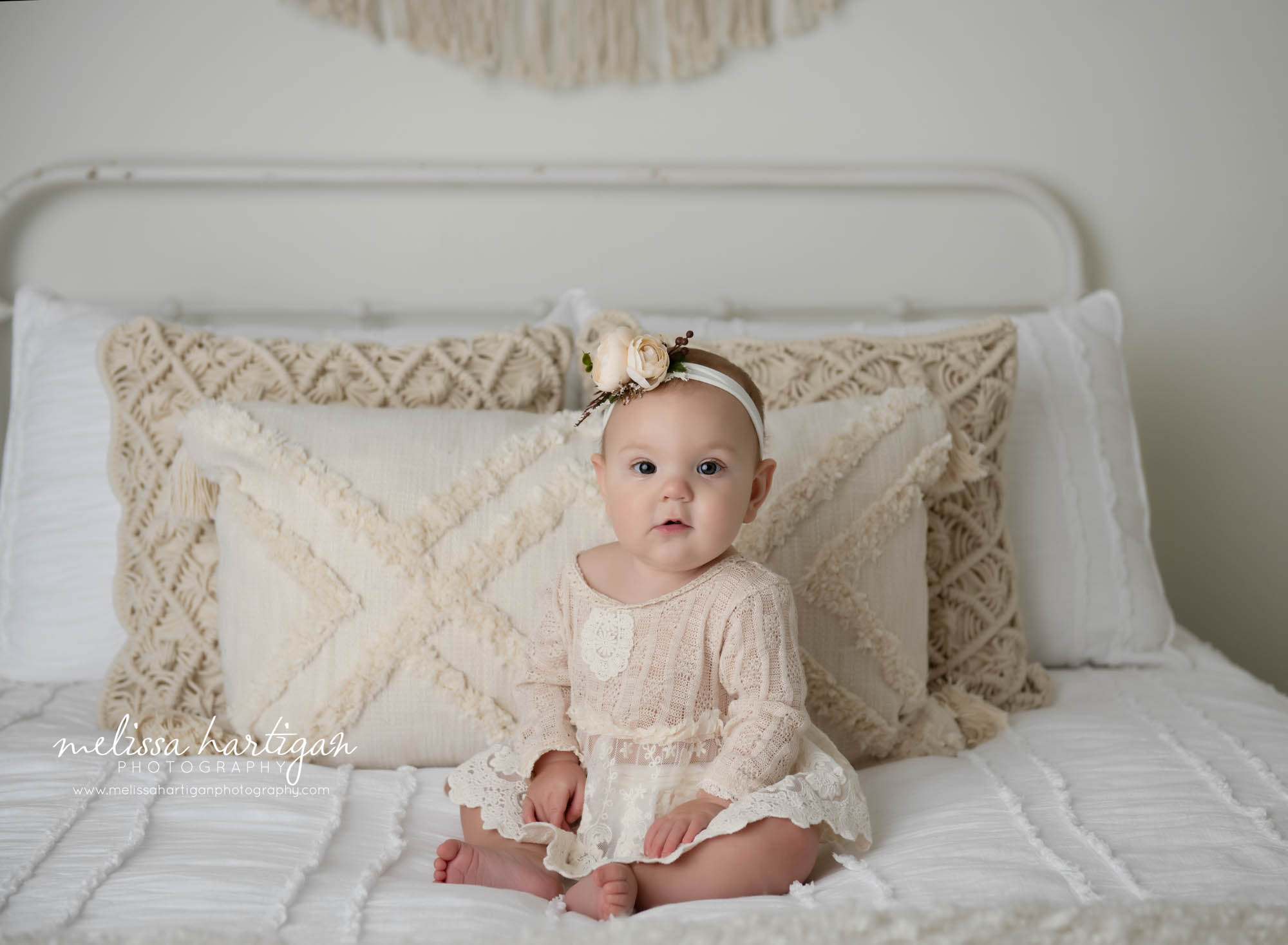 baby girl sitting on bed wearing sitting up baby milestone outfit baby photography storrs mansfield CT