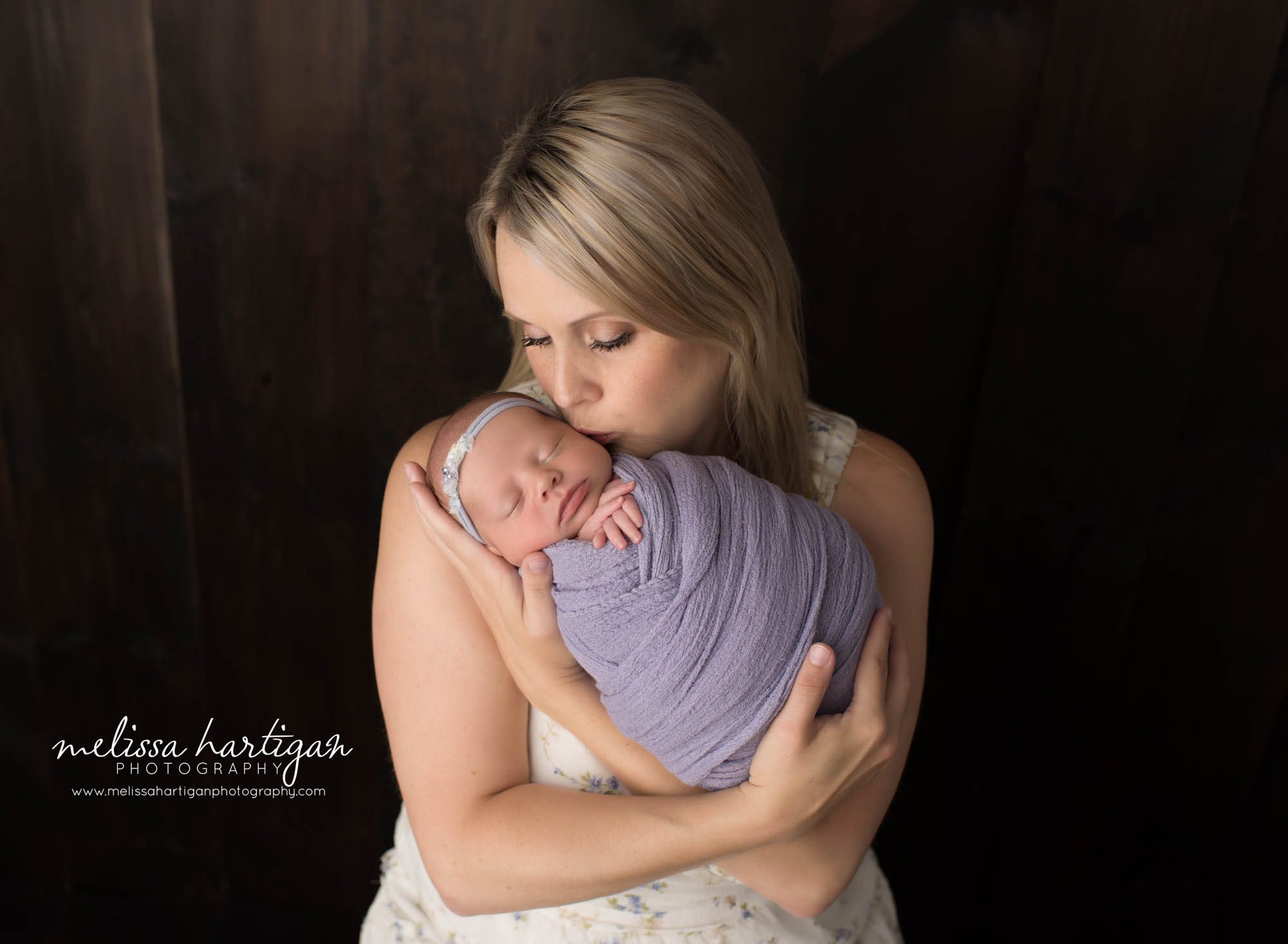  mom holding swaddled newborn daughter parent pose CT newborn photography litchfield county
