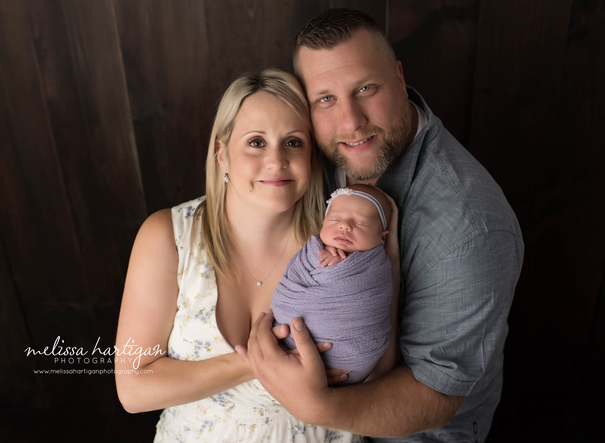mom dad newborn daughter parent family pose ct newborn photographer