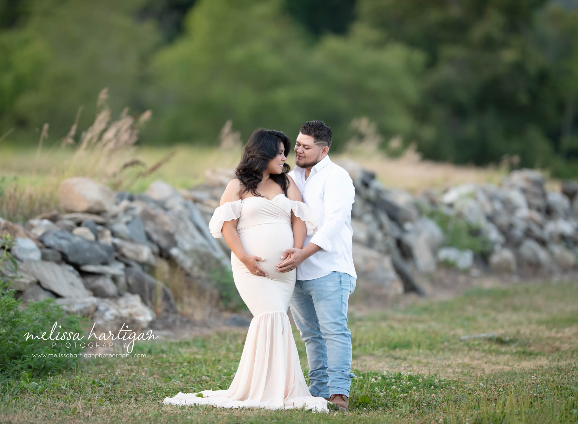 expectant couple standing holding moms pregnant baby bump connecticut maternity photographer
