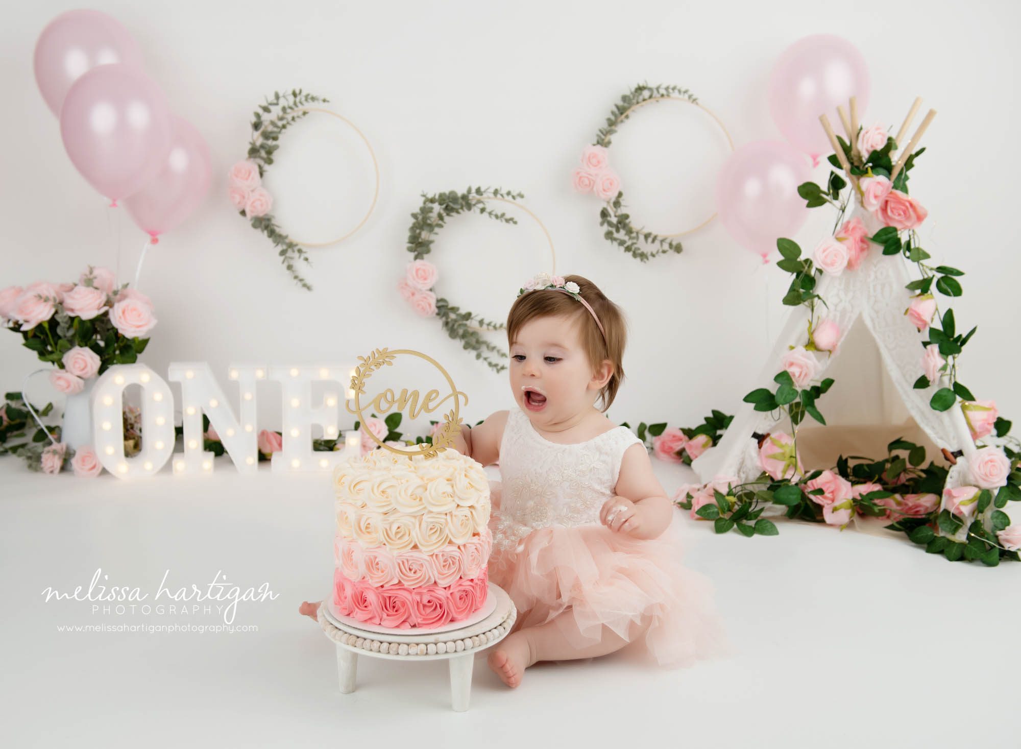 baby girl loving pink and cream smash cake